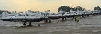 T-6 Texan IIs from the 479th Flying Training Group at Naval Air Station Pensacola, Fla., line the south ramp at Joint Base San Antonio-Randolph, Texas prior to their departure for their home station, August 31, 2012.  The aircraft had evacuated to JBSA-Randolph in anticipation of Hurricane Isaac. (U.S. Air Force photo by Benjamin Faske)