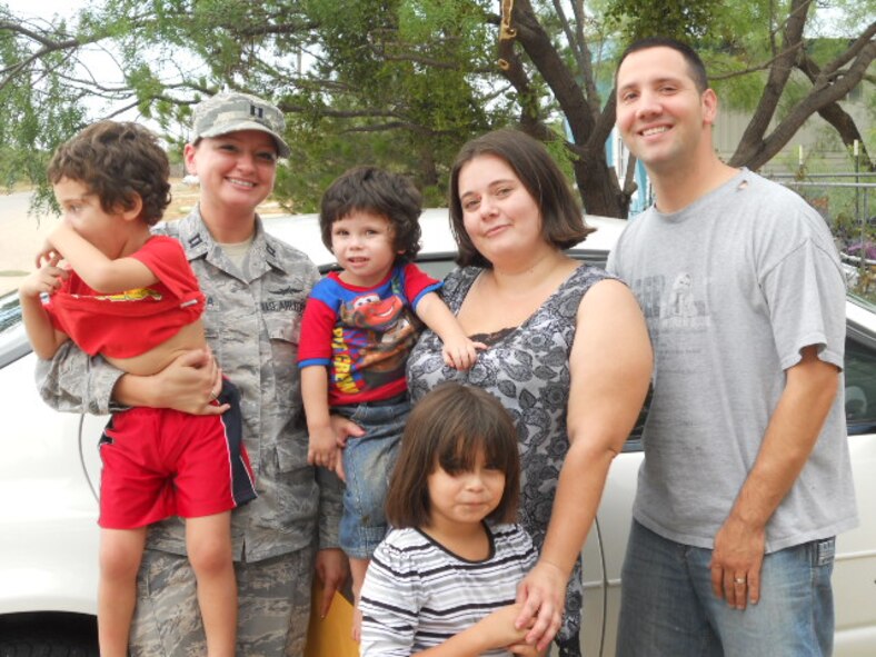 The Matta family poses with Capt. Kimber Abuhamra, left, and Staff Sgt. Paul Kibler. Kibler donated the vehicle to the Matta family. (Courtesy photo)