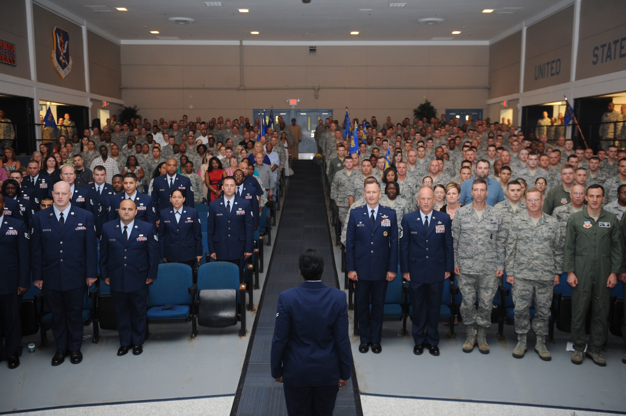 U.S. Air Force Airman 1st Class Sequoyah Moore, 23d Communications Squadron wing assistant publications manager, leads the Airman’s Creed to close the NCO promotion ceremony at Moody Air Force Base, Ga., Aug. 30, 2012. Family, friends+ and co-workers attended the ceremony to congratulate the Airmen. (U.S. Air Force photo by Airman 1st Class Olivia Dominique/Released)