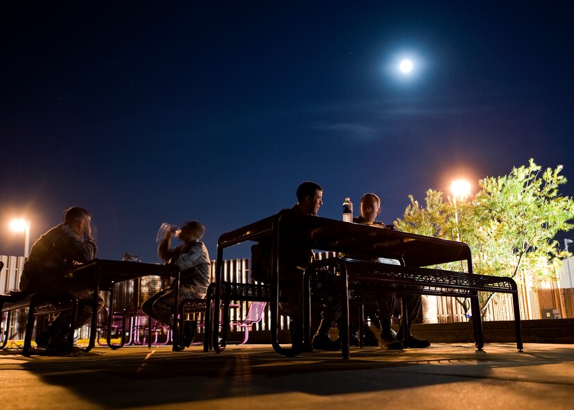 Dyess servicemembers help themselves to burgers and hotdogs during a midnight barbeque Aug. 29, 2012, at Dyess Air Force Base, Texas. The barbecue was held by the Dyess first sergeant’s group and chaplain team for Dyess personnel working swings and mid-shifts.  (U.S. Air Force photo by Airman 1st Class Damon Kasberg/Released)