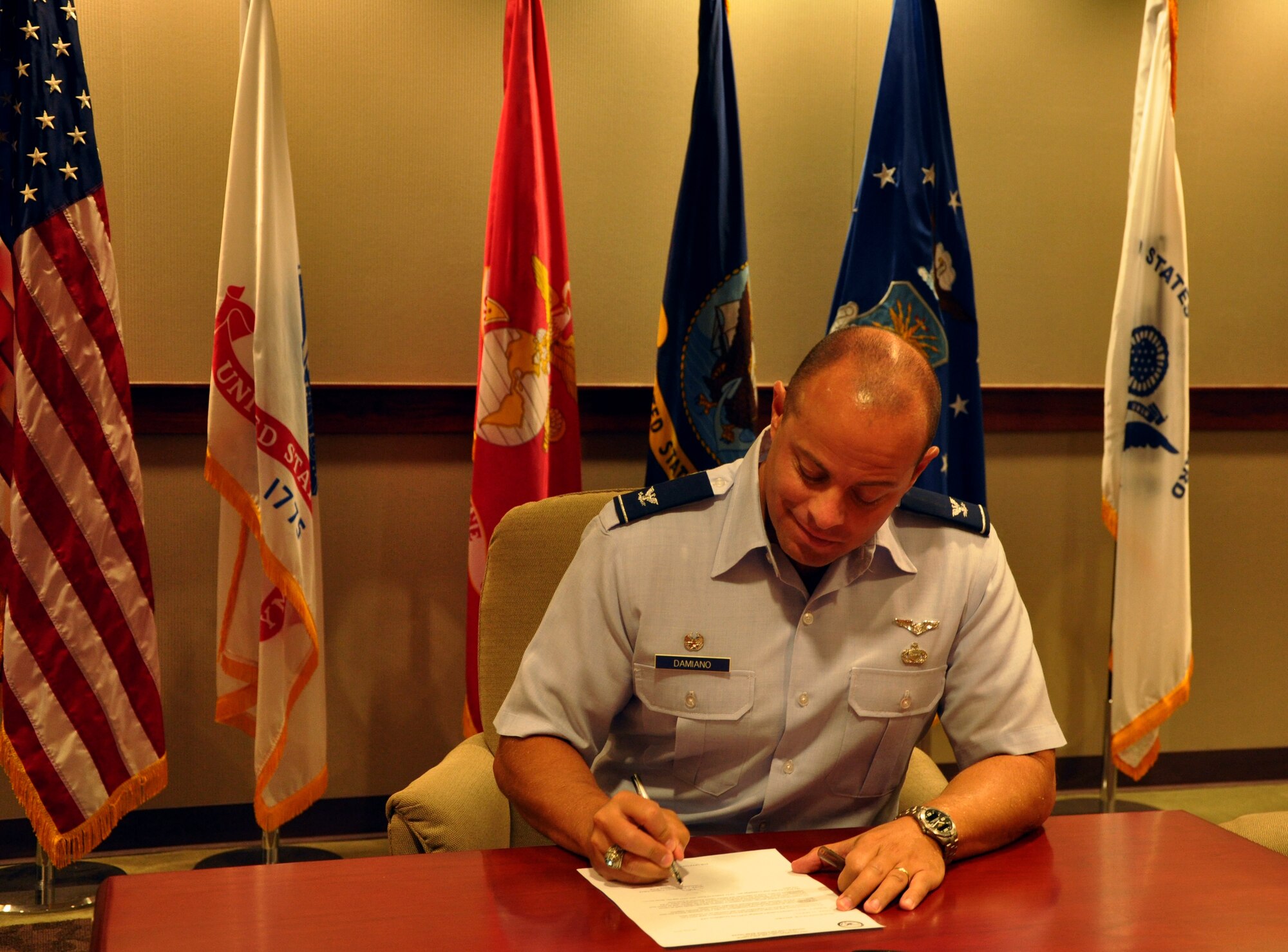 Col. Mark T. Damiano, 17th Training Wing Commander, signs the proclamation for the Combined Federal Campaign Aug. 30 here. CFC, the world’s largest annual workplace charity, is scheduled to kick-off Sept. 1 until Oct. 31. Team Goodfellow’s goal for this year is to raise $168,150 for CFC charities. Donations can be made as a one-time action or a monthly donation for as little as $5, using a payroll deduction form, which CFC representatives will provide upon request. (U.S. Air Force Photo/ Airman 1st Class Erica Flores)