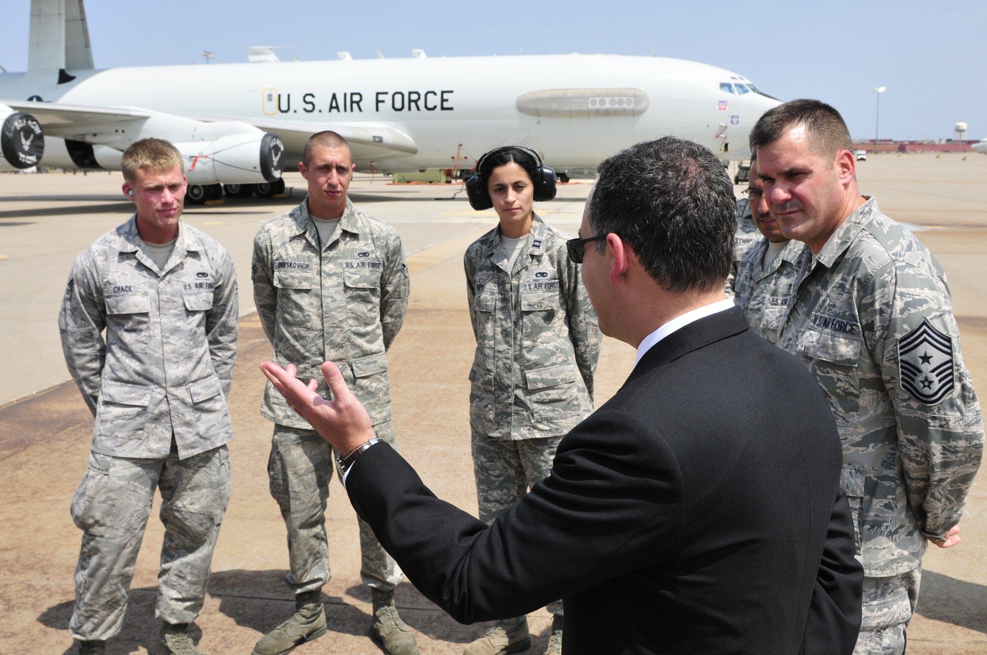 The Honorable Daniel B. Ginsberg, Assistant Secretary of the Air Force for Manpower and Reserve Affairs, visits with crewmembers of the 552nd Air Control Wing, including 552nd ACW Command Chief Master Sgt. Eddie Compton, right, prior to his tour of an E-3 Sentry Airborne Warning and Control System (AWACS) aircraft. Secretary Ginsberg toured the E-3 as part of his visit to Tinker Air Force Base on Thursday, Aug. 16 to learn more about the base and its diverse mission. (U.S. Air Force photo by Darren D. Heusel)