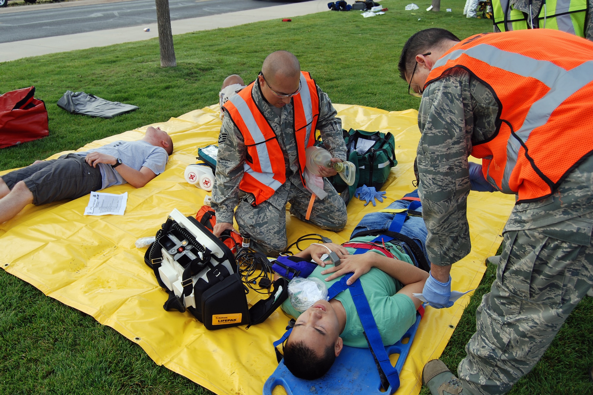 First responders prepare a lightning strike victim for transport to an area hospital during an exercise scenario Aug. 29. The Condor Crest emergency response exercise was held Aug. 26-30 as part of the 21st Space Wing's continued commitment to ensure base readiness. (U.S. Air Force photo/Lea Johnson)