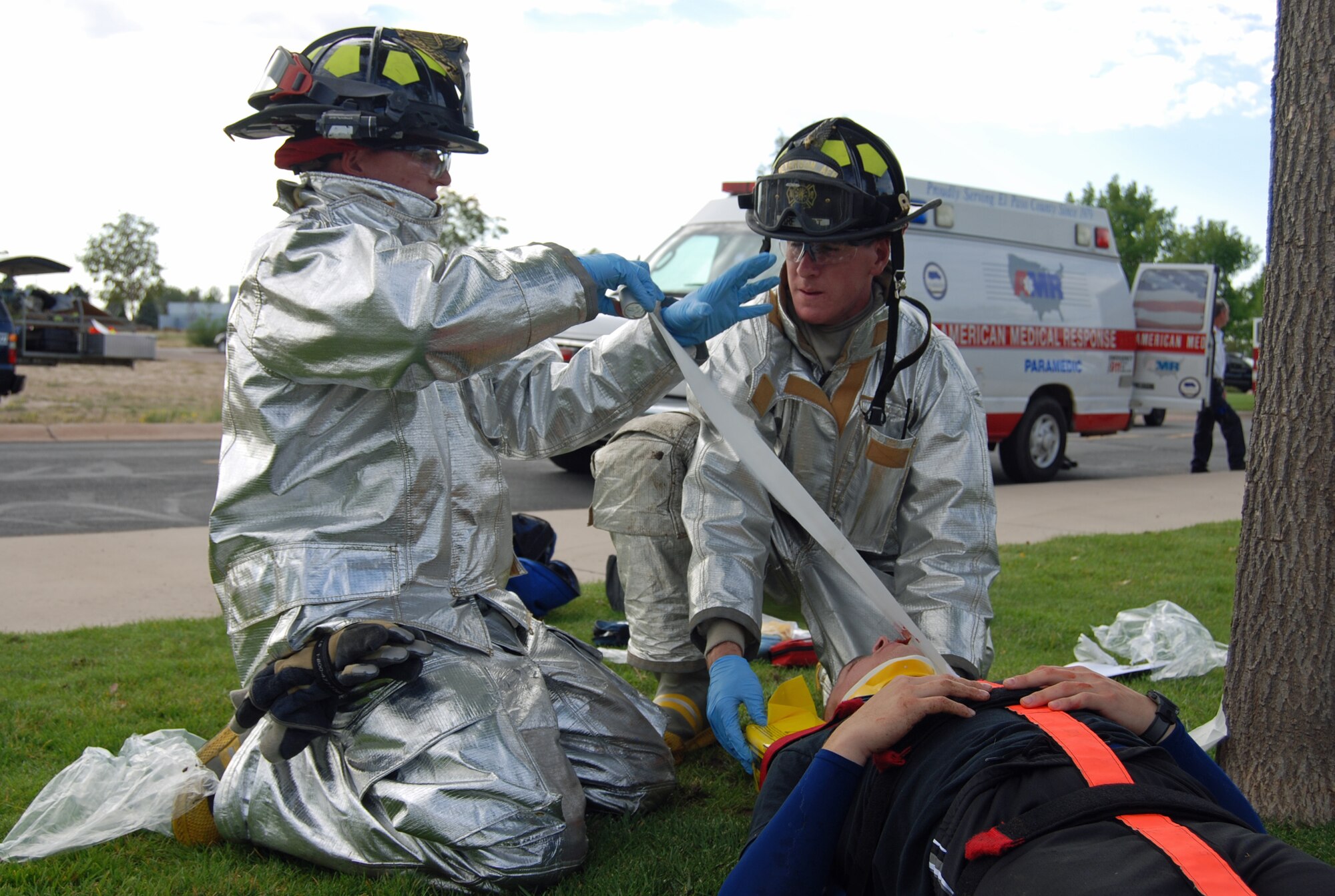 First responders prepare a lightning strike victim for transport to an area hospital during an exercise scenario Aug. 29. The Condor Crest emergency response exercise was held Aug. 26-30 as part of the 21st Space Wing's continued commitment to ensure base readiness. (U.S. Air Force photo/Lea Johnson)