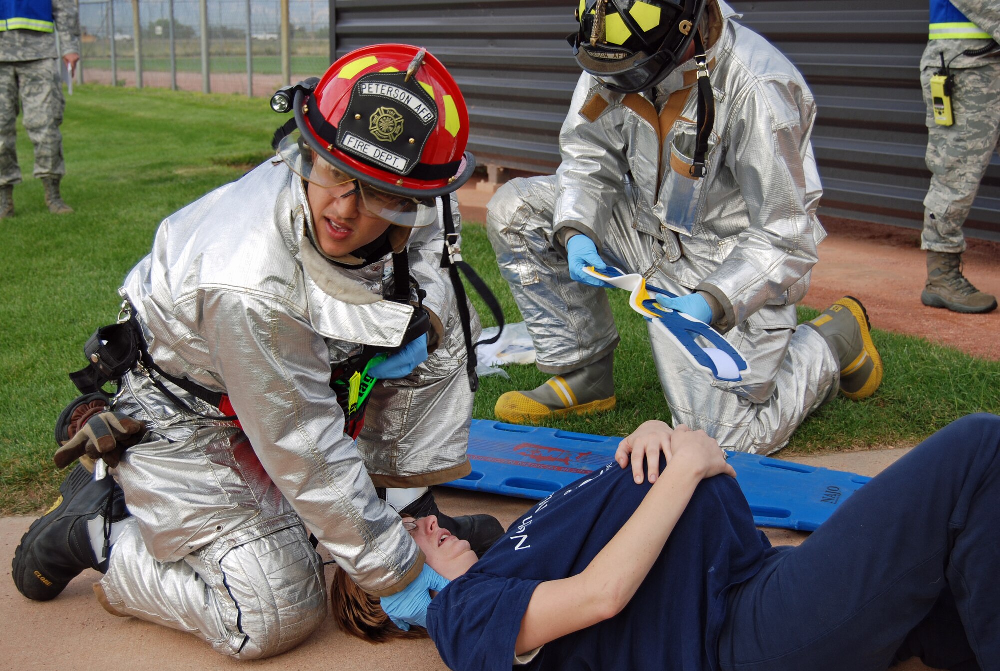 First responders take a victim from a lightning strike to be taken Flight for Life to an area hospital during an exercise scenario Aug. 29. The Condor Crest emergency response exercise was held Aug. 26-30 as part of the 21st Space Wing's continued commitment to ensure base readiness. (U.S. Air Force photo/Lea Johnson)