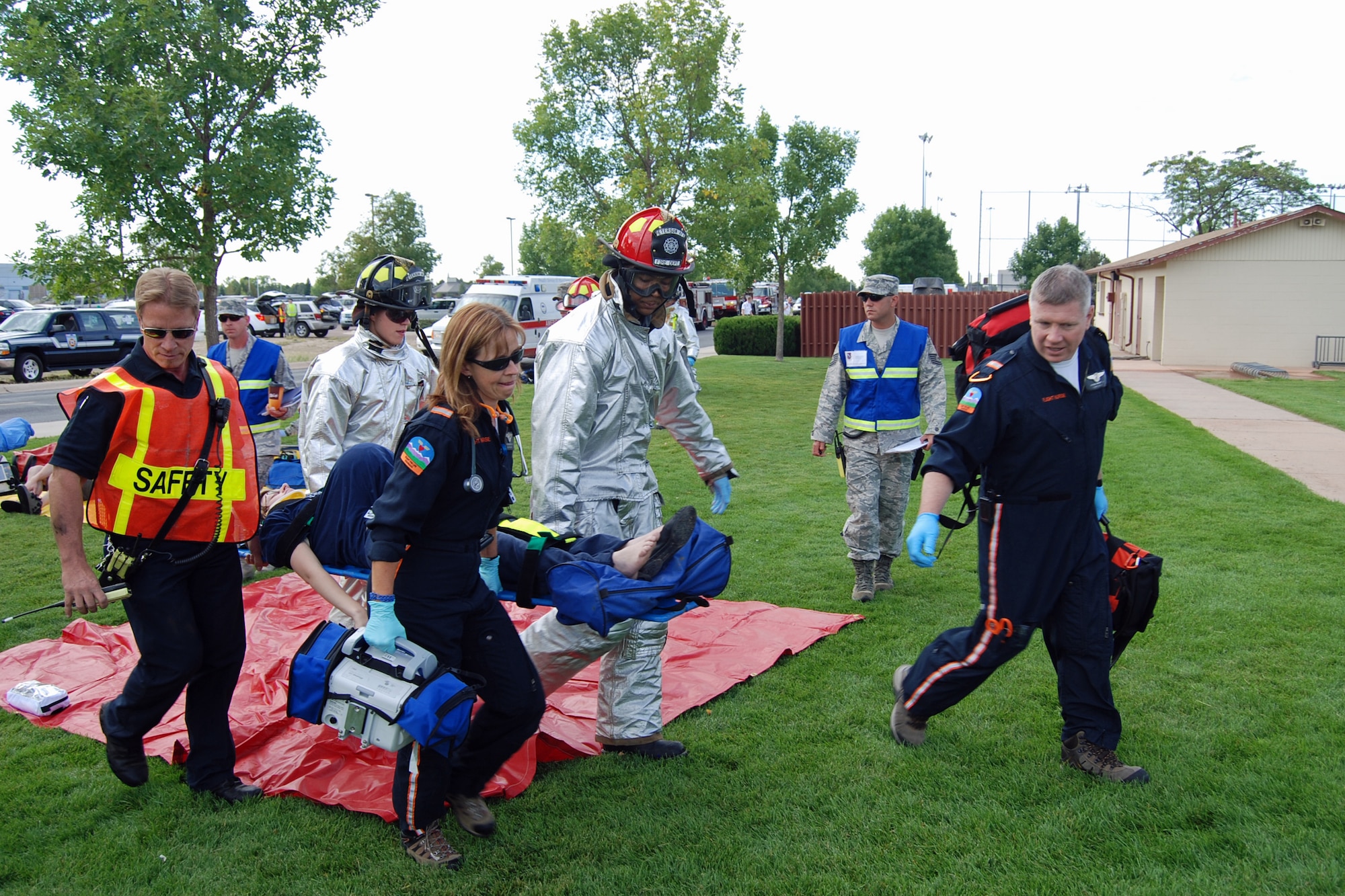First responders take a victim from a lightning strike to be taken Flight for Life to an area hospital during an exercise scenario Aug. 29. The Condor Crest emergency response exercise was held Aug. 26-30 as part of the 21st Space Wing's continued commitment to ensure base readiness. (U.S. Air Force photo/Lea Johnson)