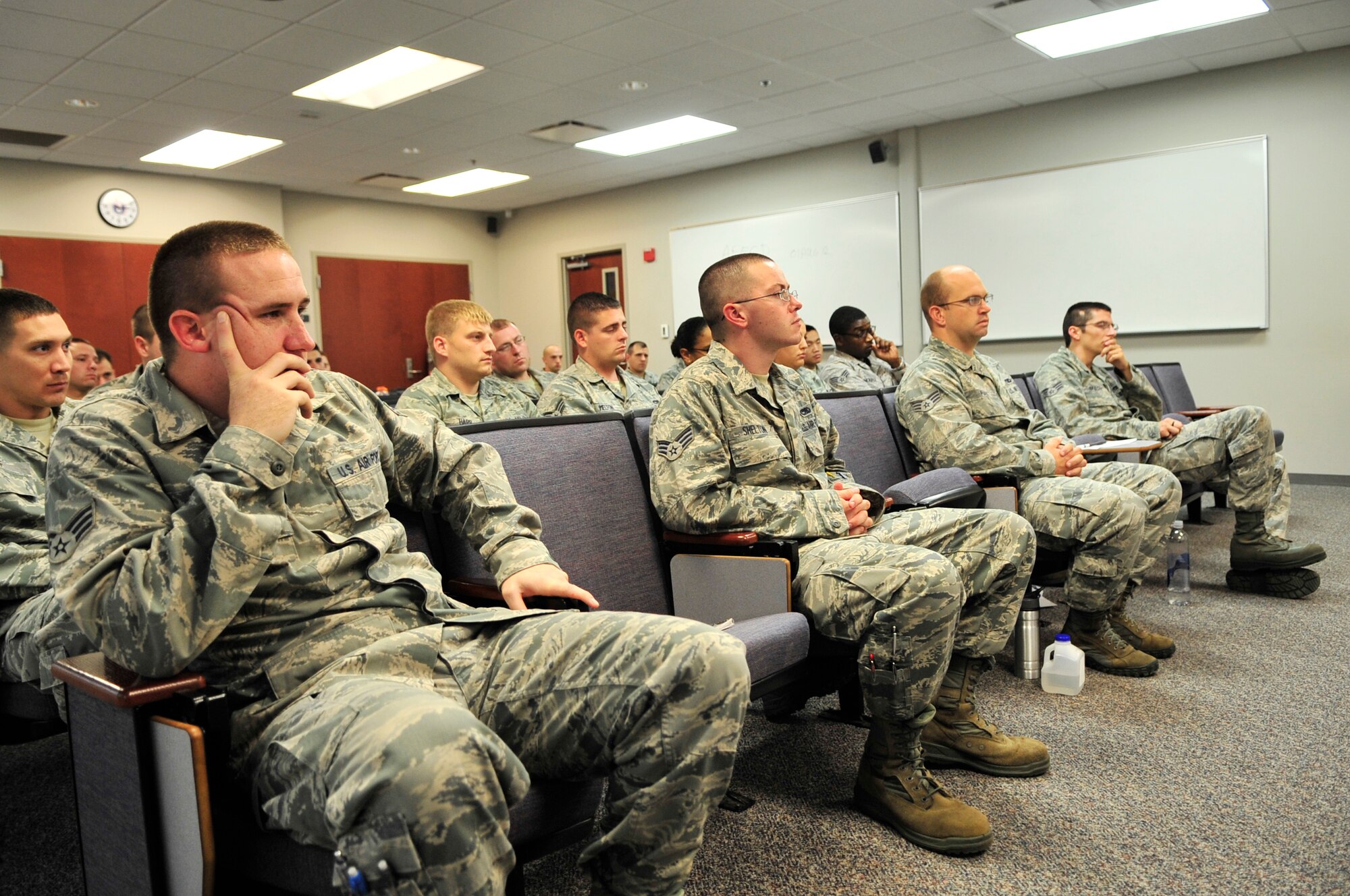U.S. Air Force Airmen listen as retired U.S. Army  Sgt. Scott Stephenson and his mother Luana Schneider speak at the airman leadership school, Shaw Air Force Base, S.C. Aug. 29, 2012.  Stephenson talked to the future leaders about his experience of being injured while on a deployment in Iraq, and the resiliency he practices in his life to stay positive while living with his scars.(U.S. Air Force photo by Airman Nicole Sikorski/Released)