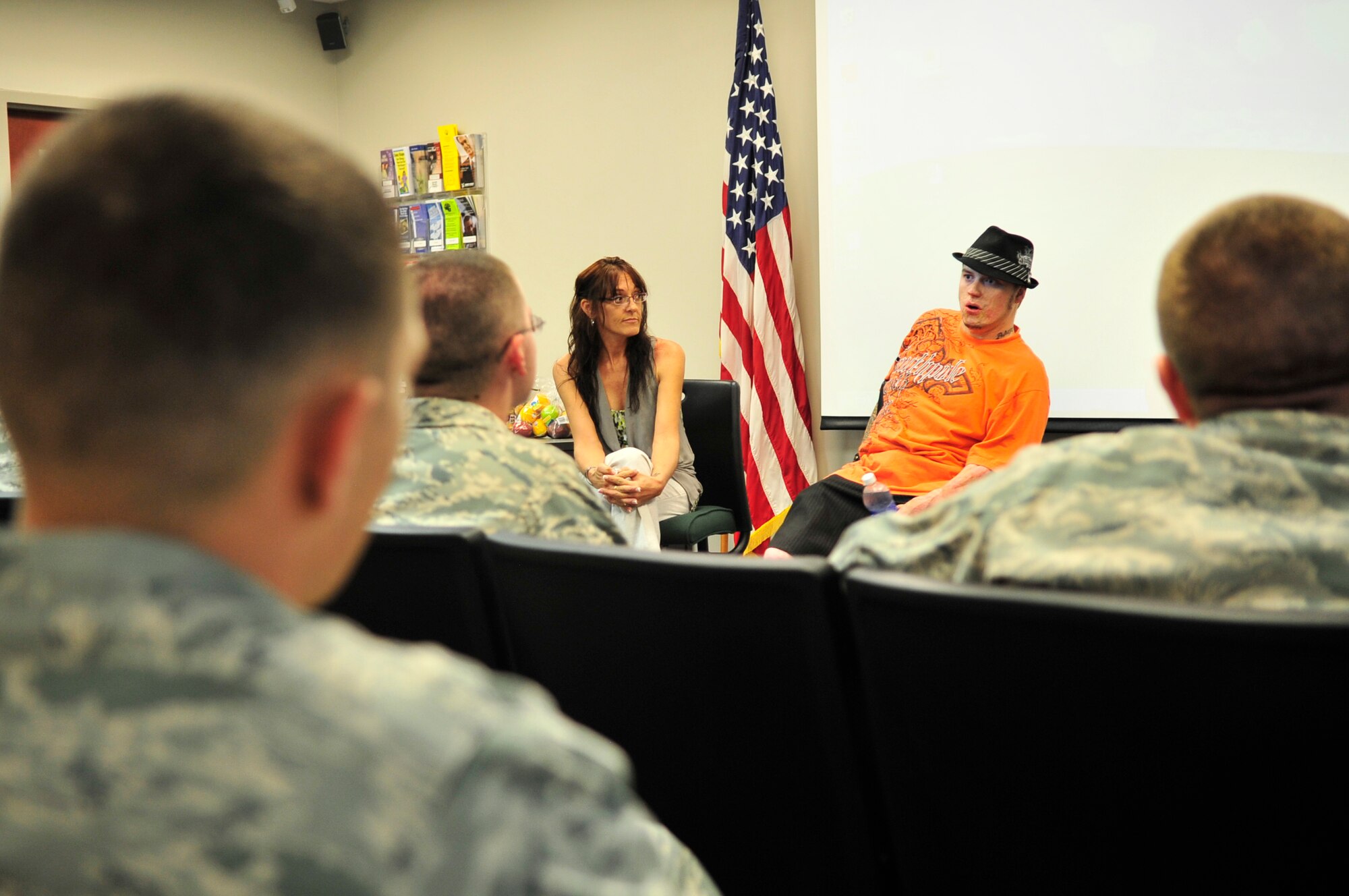 Retired U.S. Army  Sgt. Scott Stephenson and his mother Luana Schneider speak at the airman leadership school, Shaw Air Force Base, S.C. Aug. 29, 2012.  Stephenson talked to the future leaders about his experience of being injured while on a deployment in Iraq, and the resiliency he practices in his life to stay positive while living with his scars.(U.S. Air Force photo by Airman Nicole Sikorski/Released)