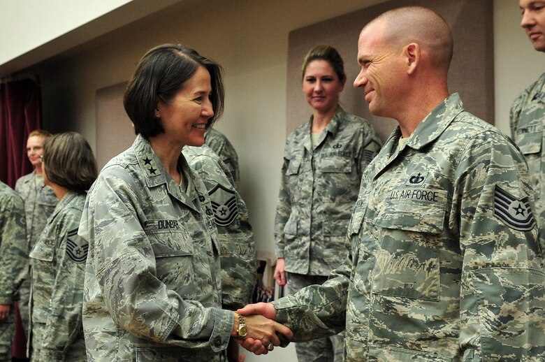 Air Force District of Washington Commander Maj. Gen. Sharon K.G. Dunbar greets Tech. Sgt. Taylor Armstrong, U.S. Air Force Band musician, during a tour of the band hangar, Aug. 24, on Joint Base Anacostia-Bolling, Washington, D.C.  Dunbar assumed command of AFDW July 26 and has been impressed with capabilities she has seen by Airmen throughout the National Capital Region so far. (U.S. Air Force photo by Senior Airman Steele C. G. Britton)