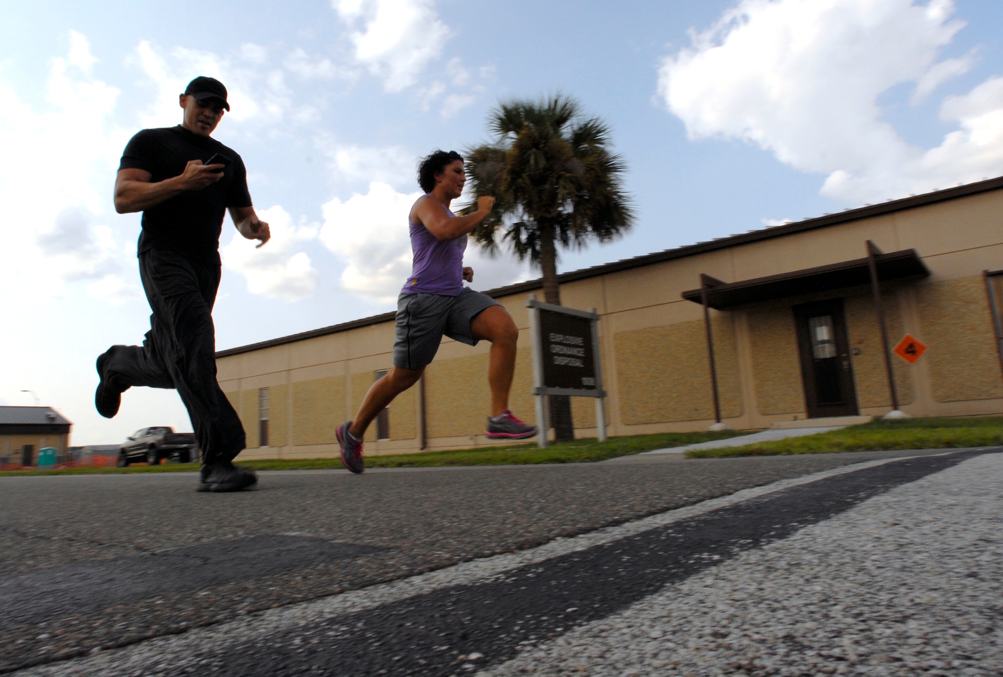 125th Fighter Wing Medical Service Journeyman, Staff Sgt. Mariam Abdallah (right), finishes a 400 yard run with 125th Fighter Wing Health Promotions Officer, Captain Jesus Garcia by her side,125th Fighter Wing, Jacksonville, Fla, August 18, 2012. Garcia and his partner Christina Sox,  have developed an easy to follow fitness plan utilizing Tabata, a high intensity interval training tool aimed to help members of the 125th Fighter Wing, Florida Air National Guard meet their fitness goals.  (Air National Guard photo by MSgt. Shelley Gill)