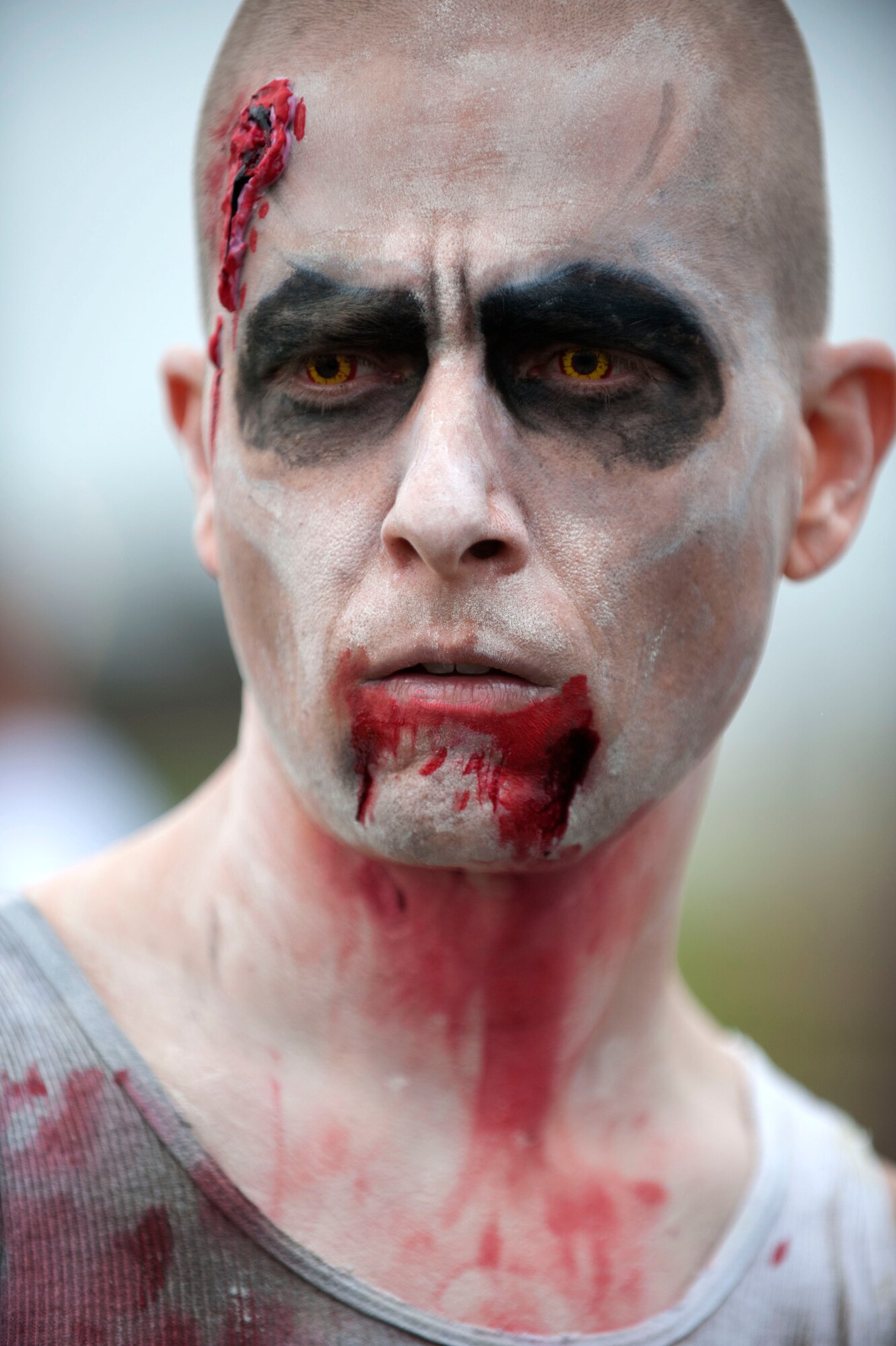 SPANGDAHLEM AIR BASE, Germany – Master Sgt. Shane Reed, 726th Air Mobility Squadron passenger services superintendant, readies himself for a zombie 5k fundraiser here Aug. 31.  Base members dressed as zombies and chased runners, who competed for time against other groups to complete a series of obstacles.  The 52nd Logistics Readiness Squadron hosted the event to raise funds for the squadron. (U.S. Air Force photo by Airman 1st Class Gustavo Castillo/Released)