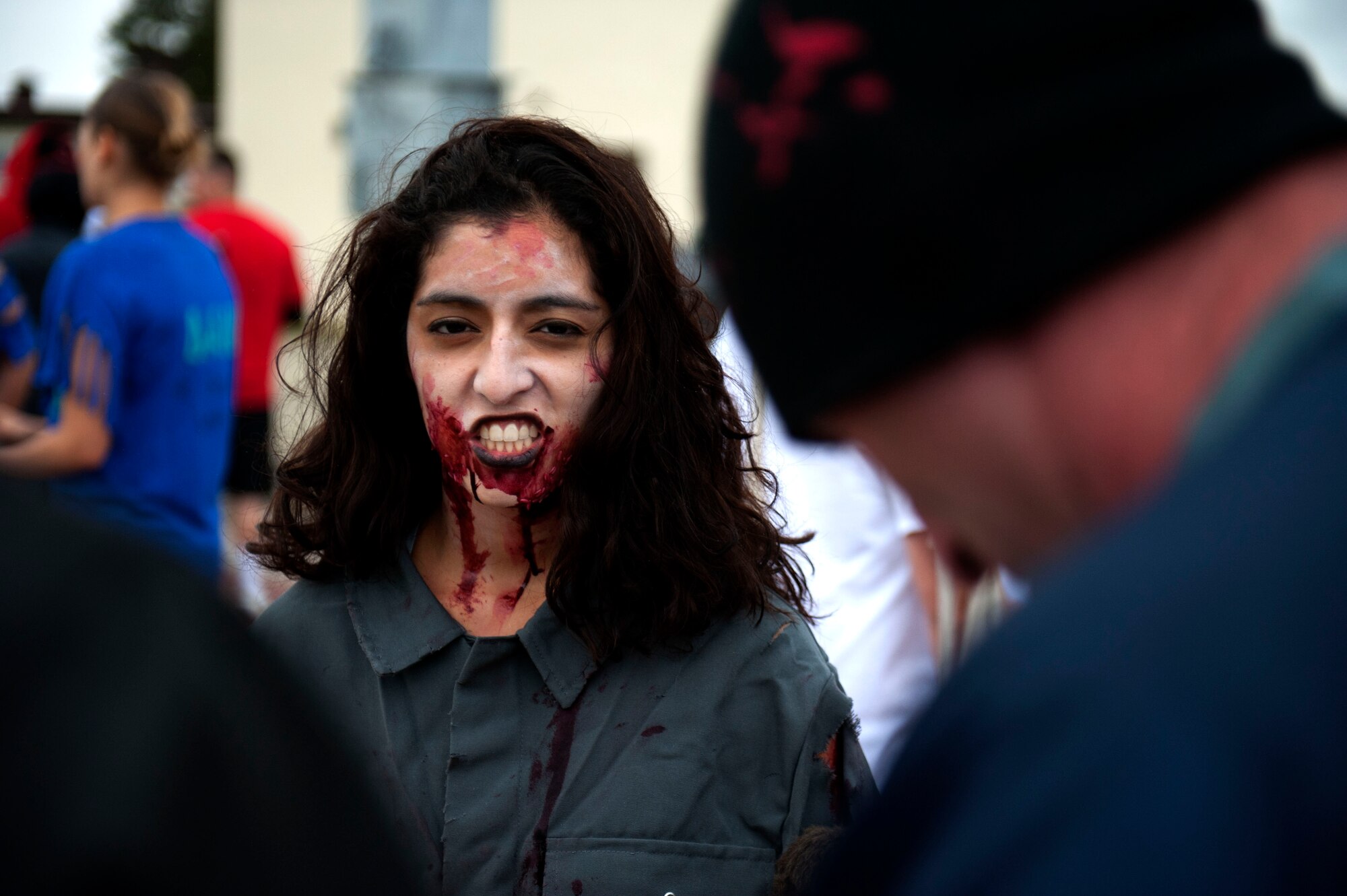 SPANGDAHLEM AIR BASE, Germany – Second Lt. Victoria Villa, 726th Air Mobility Squadron passenger services officer in charge, poses before participating in a zombie 5K fundraiser here Aug. 31.  Base members dressed as zombies and chased runners, who competed for time against other groups to complete a series of obstacles.  The 52nd Logistics Readiness Squadron hosted the event to raise funds for the squadron. (U.S. Air Force photo by Airman 1st Class Gustavo Castillo/Released)