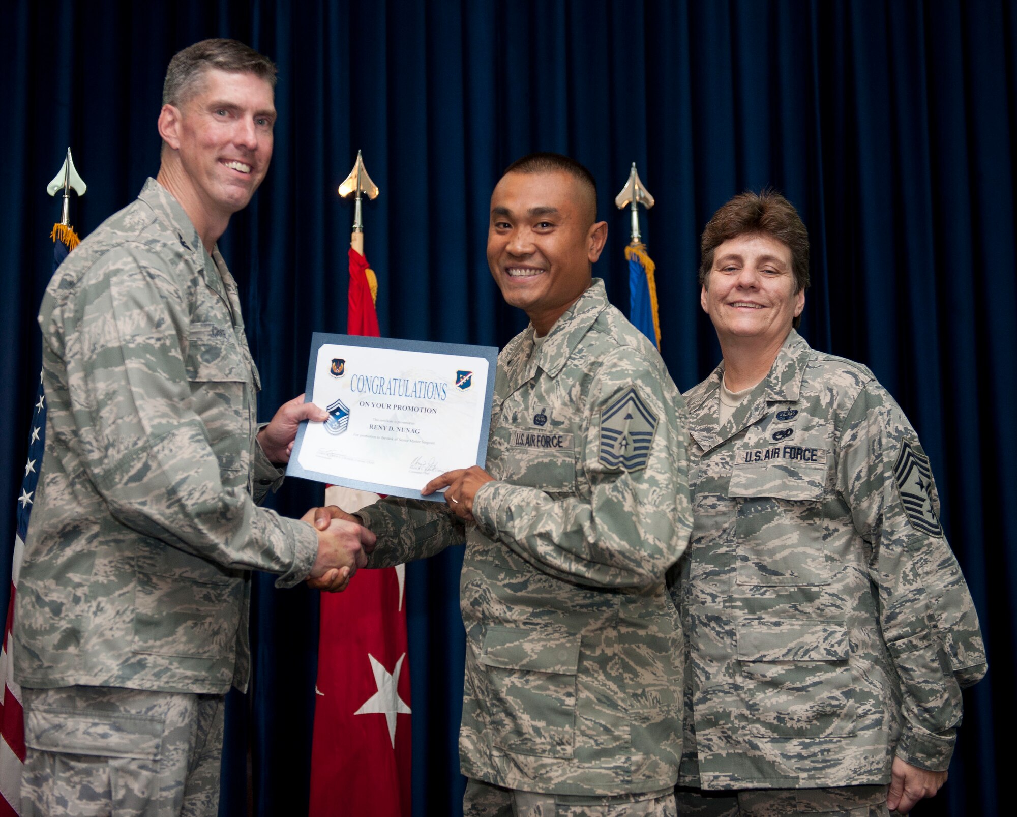 Reny Nunag, 39th Communications Squadron, is promoted to the rank of senior master sergeant Aug. 31, 2012, at the club complex ballroom at Incirlik Air Base, Turkey. (U.S. Air Force photo by Senior Airman Clayton Lenhardt/Released)