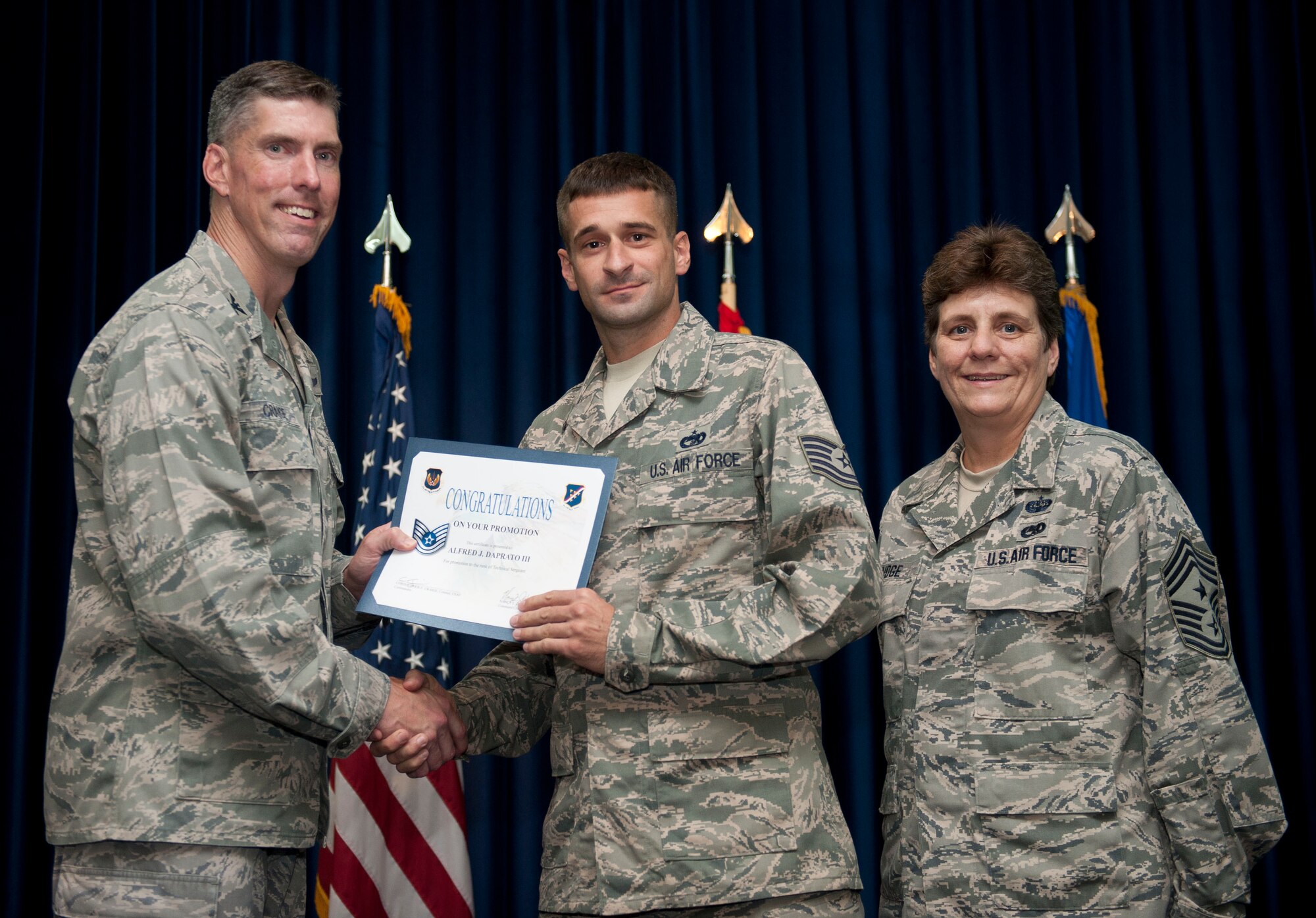 Alfred Daprato, 728th Air Mobility Squadron, is promoted to the rank of technical sergeant Aug. 31, 2012, at the club complex ballroom at Incirlik Air Base, Turkey. (U.S. Air Force photo by Senior Airman Clayton Lenhardt/Released)
