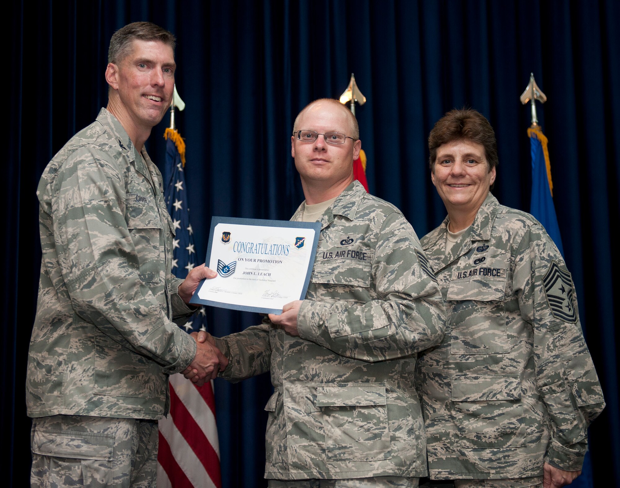 John Leach, 39th Operations Squadron, is promoted to the rank of technical sergeant Aug. 31, 2012, at the club complex ballroom at Incirlik Air Base, Turkey. (U.S. Air Force photo by Senior Airman Clayton Lenhardt/Released)