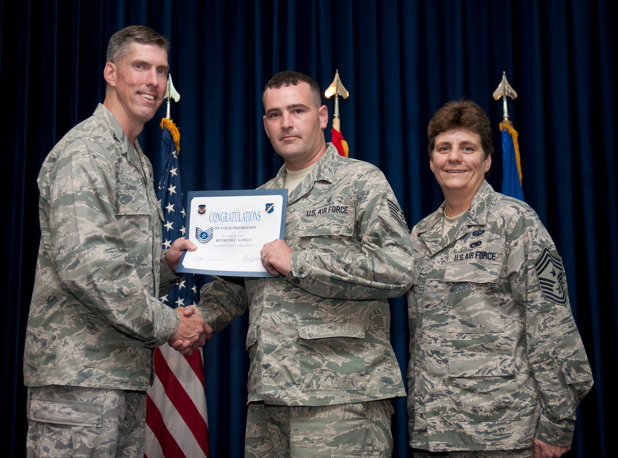 Kenneth Gately, 39th Medical Support Squadron, is promoted to the rank of technical sergeant Aug. 31, 2012, at the club complex ballroom at Incirlik Air Base, Turkey. (U.S. Air Force photo by Senior Airman Clayton Lenhardt/Released)