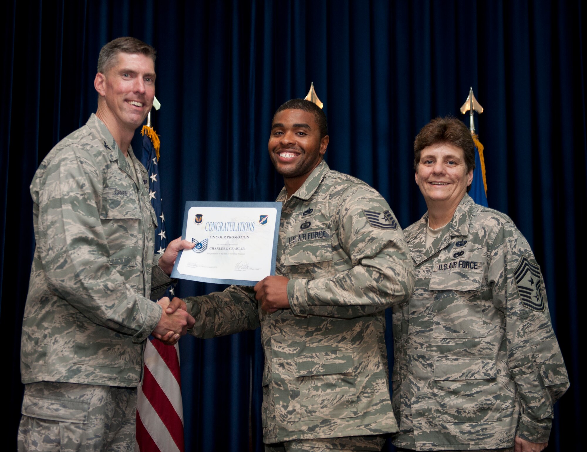 Charles Craig, 39th Contracting Squadron, is promoted to the rank of technical sergeant Aug. 31, 2012, at the club complex ballroom at Incirlik Air Base, Turkey. (U.S. Air Force photo by Senior Airman Clayton Lenhardt/Released)