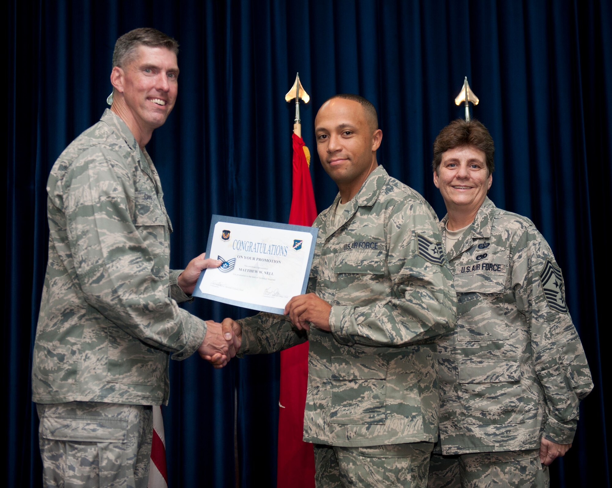 Matthew Nell, 39th Communications Squadron, is promoted to the rank of technical sergeant Aug. 31, 2012, at the club complex ballroom at Incirlik Air Base, Turkey. (U.S. Air Force photo by Senior Airman Clayton Lenhardt/Released)