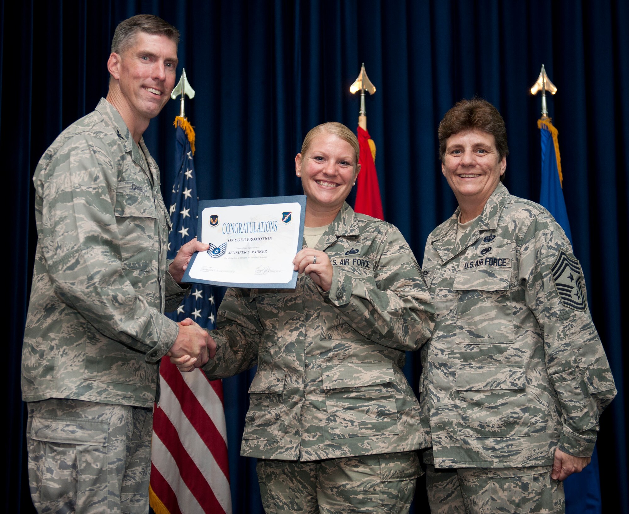 Jennifer Parker, 39th Logistics Readiness Squadron, is promoted to the rank of technical sergeant Aug. 31, 2012, at the club complex ballroom at Incirlik Air Base, Turkey. (U.S. Air Force photo by Senior Airman Clayton Lenhardt/Released)
