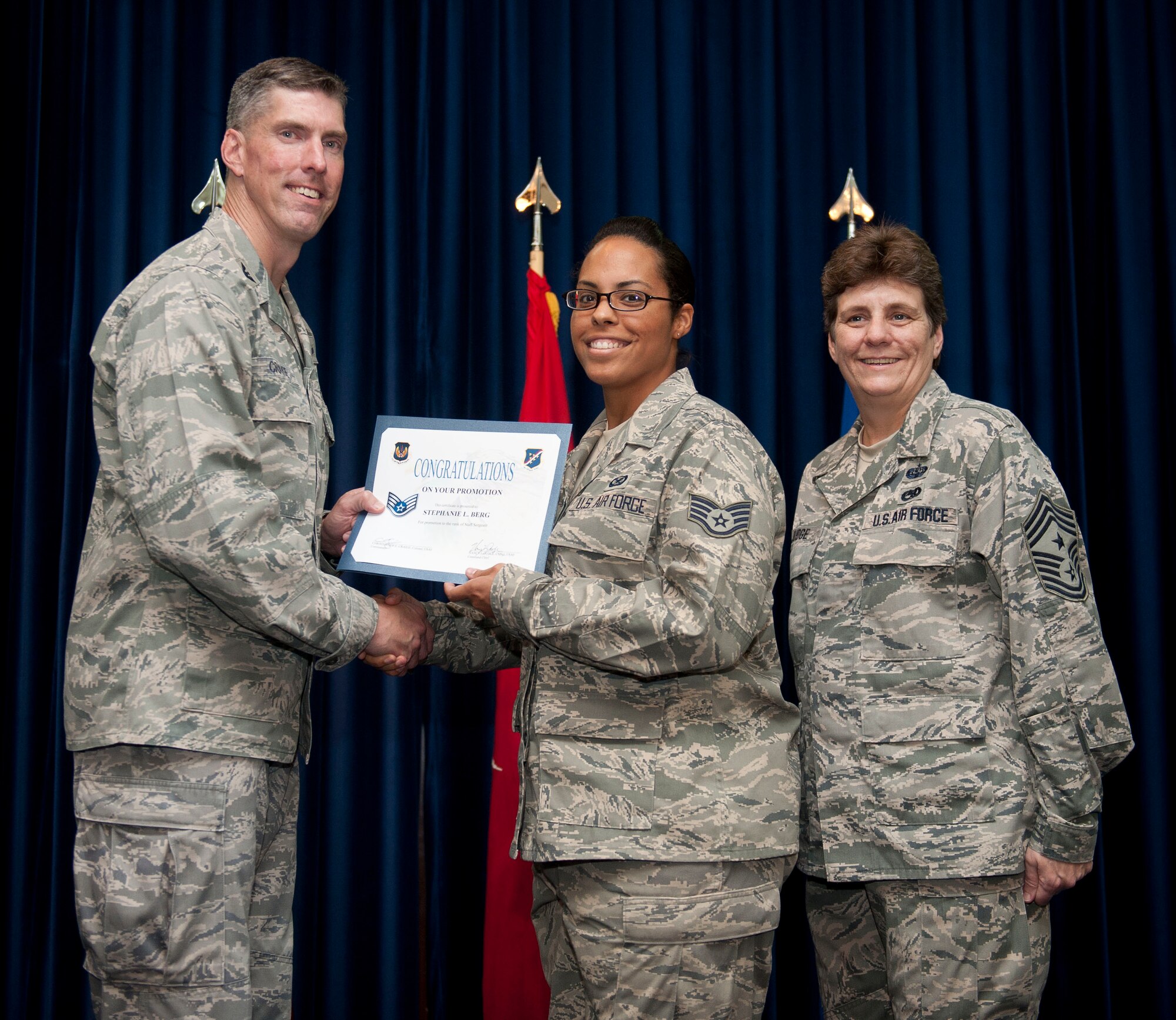 Stephanie Berg, American Forces Network Incirlik, is promoted to the rank of staff sergeant Aug. 31, 2012, at the club complex ballroom at Incirlik Air Base, Turkey. (U.S. Air Force photo by Senior Airman Clayton Lenhardt/Released)