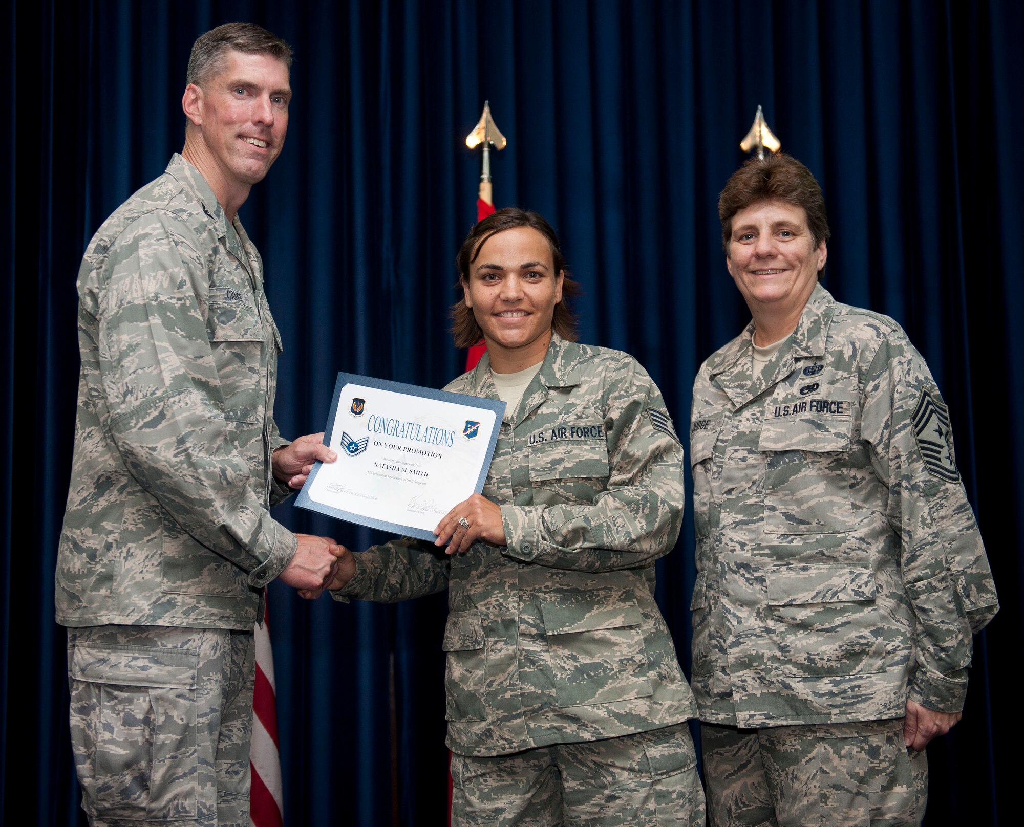 Natasha Smith, 39th Operations Squadron, is promoted to the rank of staff sergeant Aug. 31, 2012, at the club complex ballroom at Incirlik Air Base, Turkey. (U.S. Air Force photo by Senior Airman Clayton Lenhardt/Released)