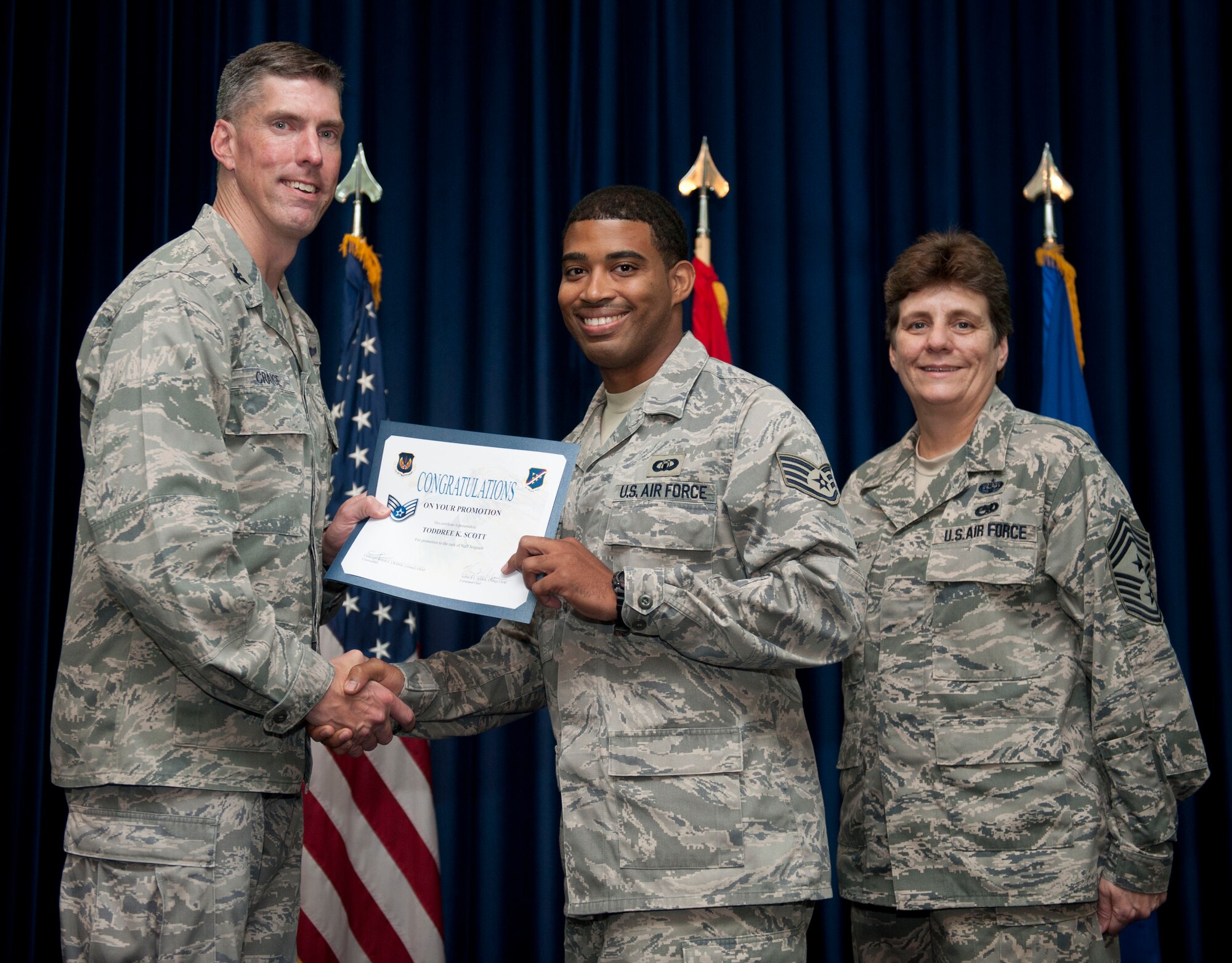 Toddree Scott, 39th Operations Squadron, is promoted to the rank of staff sergeant Aug. 31, 2012, at the club complex ballroom at Incirlik Air Base, Turkey. (U.S. Air Force photo by Senior Airman Clayton Lenhardt/Released)