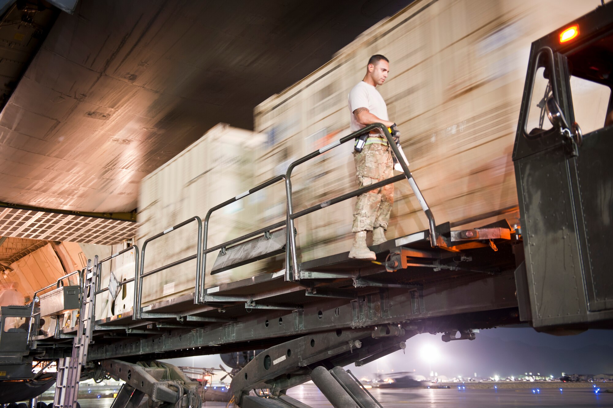 An Airman from the 455th Expeditionary Aerial Port Squadron oversee the offload of several pallets from a U.S. Air Force C-5B Galaxy at Bagram Airfield, Afghanistan Aug. 30, 2012. The C-5 has a greater capacity than any other USAF airlifter and can simultaneously carry three dozen pallets and more than 80 people. The aircraft’s capacity is large enough to carry any of the Army's air-transportable combat equipment. (U.S. Air Force Photo/Capt. Raymond Geoffroy)