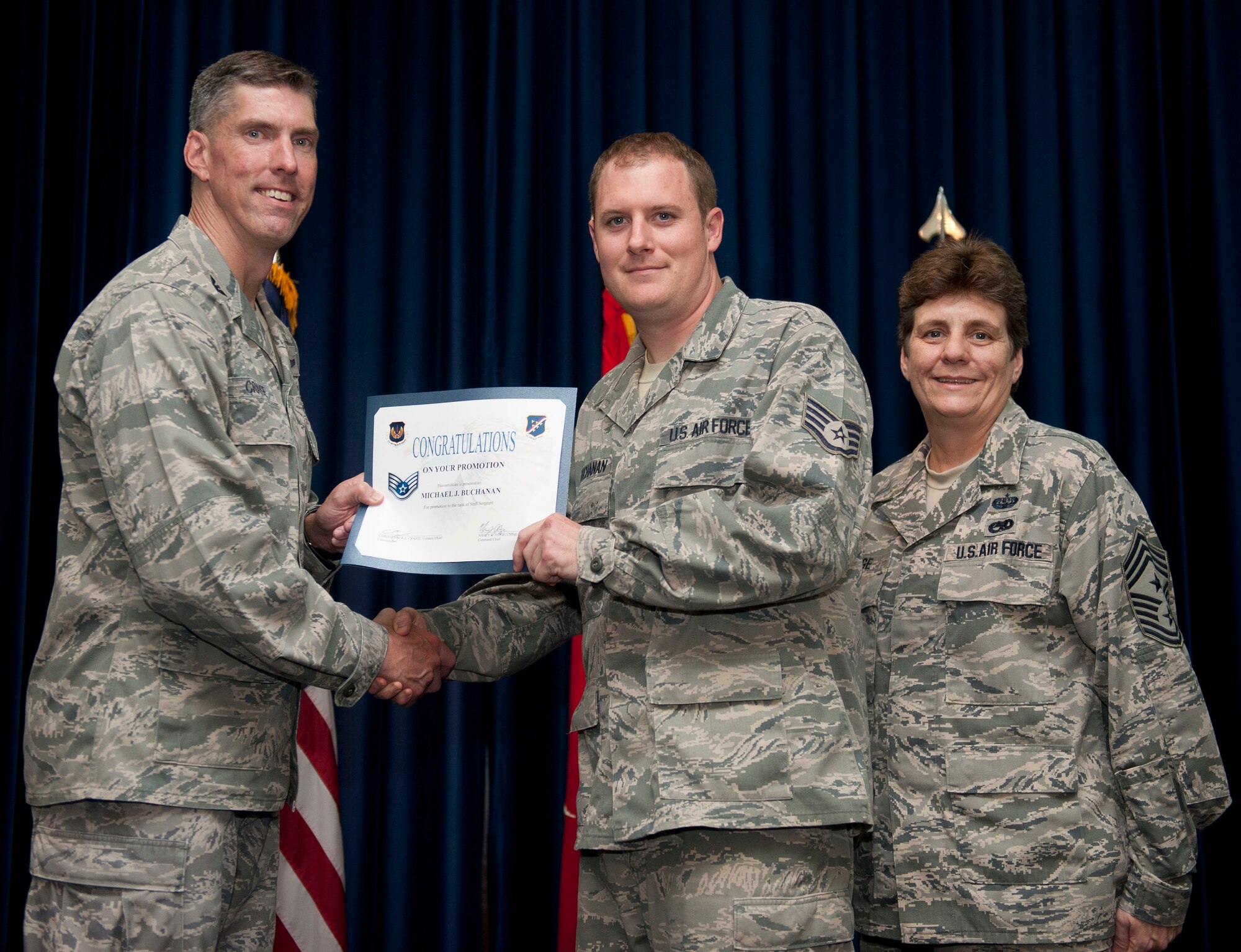 Michael Buchanan, 39th Medical Operations Squadron, is promoted to the rank of staff sergeant Aug. 31, 2012, at the club complex ballroom at Incirlik Air Base, Turkey. (U.S. Air Force photo by Senior Airman Clayton Lenhardt/Released)