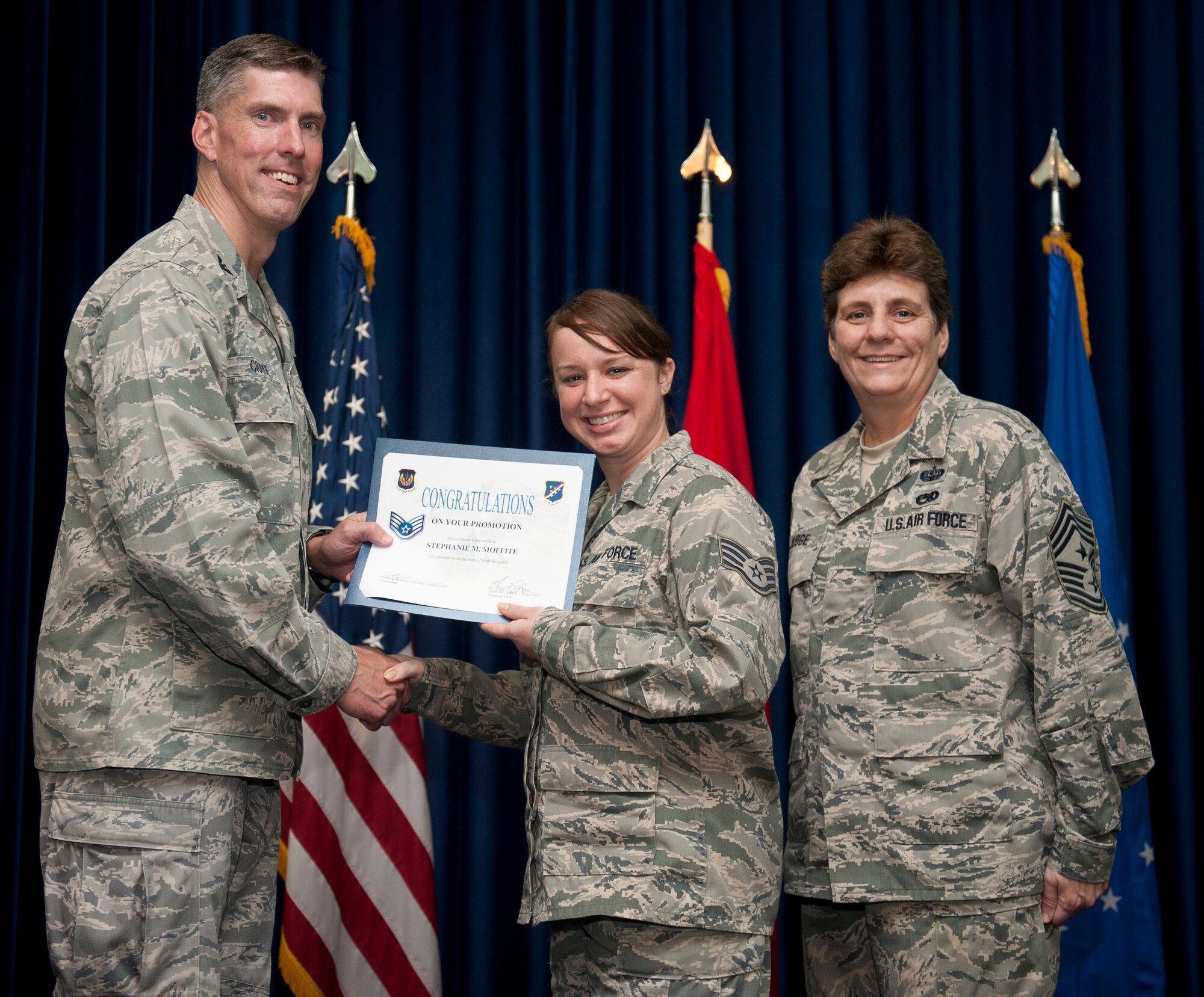Stephanie Moffite, 39th Communications Squadron, is promoted to the rank of staff sergeant Aug. 31, 2012, at the club complex ballroom at Incirlik Air Base, Turkey. (U.S. Air Force photo by Senior Airman Clayton Lenhardt/Released)
