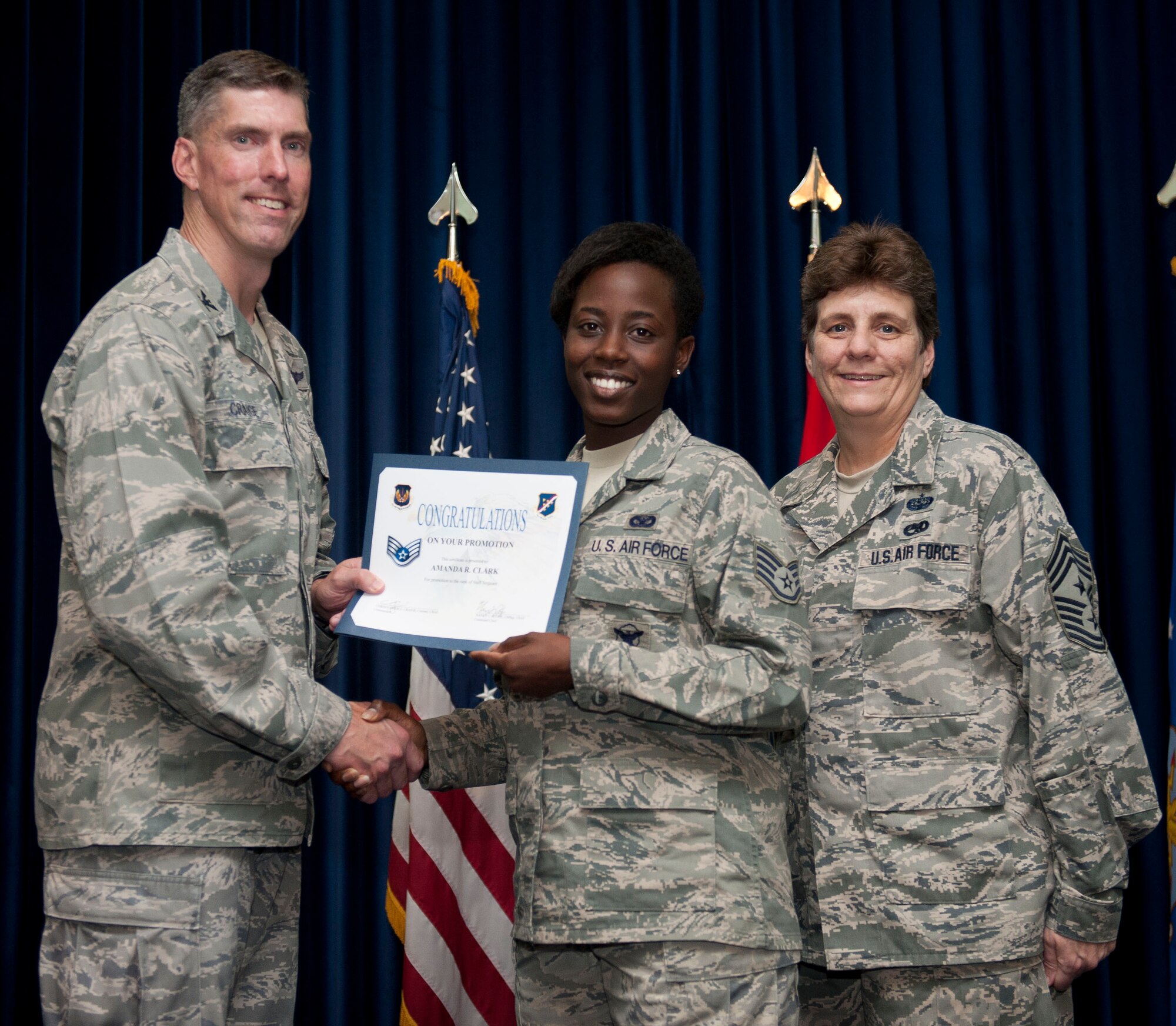 Amanda Clark, 39th Security Forces Squadron, is promoted to the rank of staff sergeant Aug. 31, 2012, at the club complex ballroom at Incirlik Air Base, Turkey. (U.S. Air Force photo by Senior Airman Clayton Lenhardt/Released)