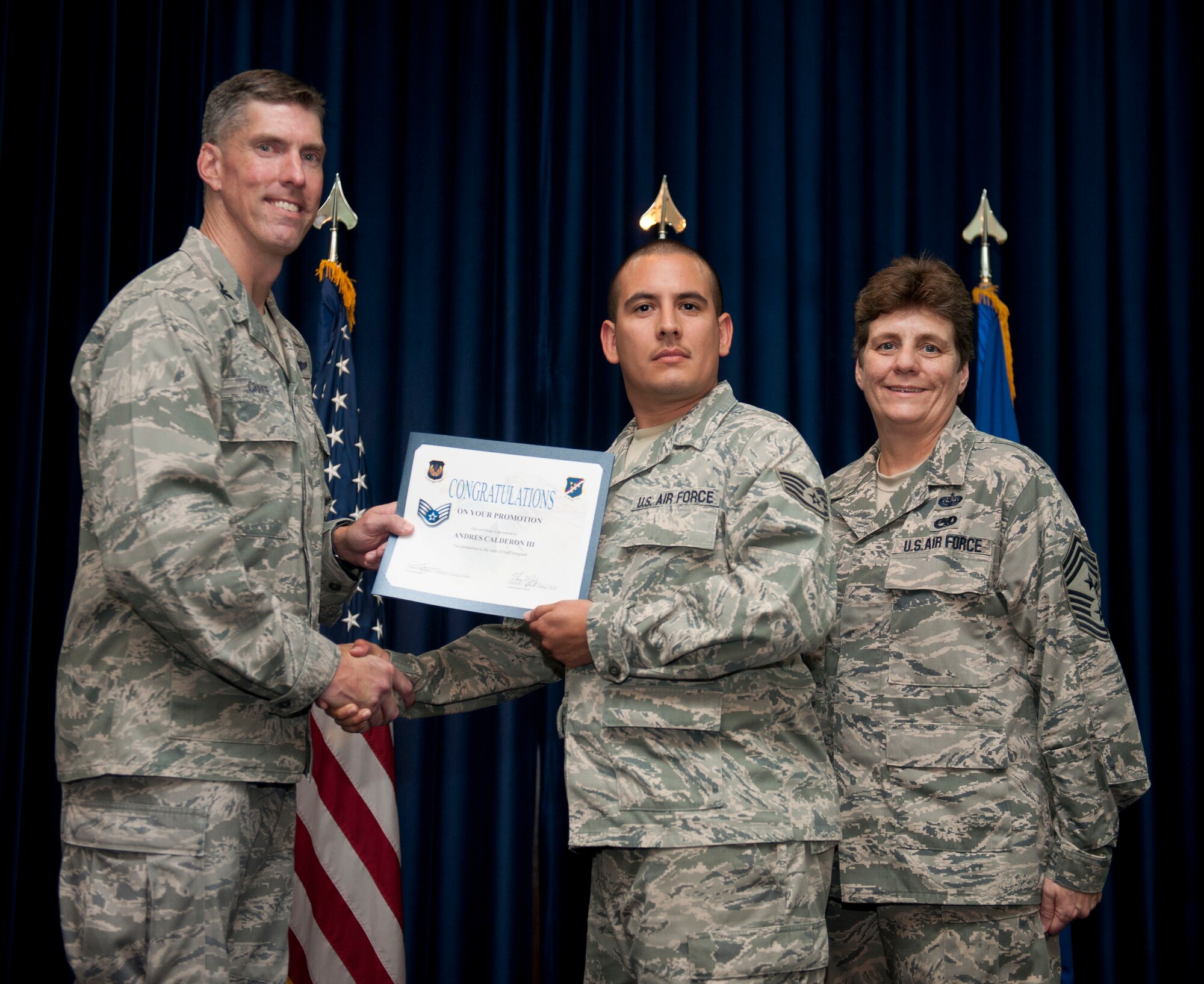Andres Calderon, 39th Maintenance Squadron, is promoted to the rank of staff sergeant Aug. 31, 2012, at the club complex ballroom at Incirlik Air Base, Turkey. (U.S. Air Force photo by Senior Airman Clayton Lenhardt/Released)