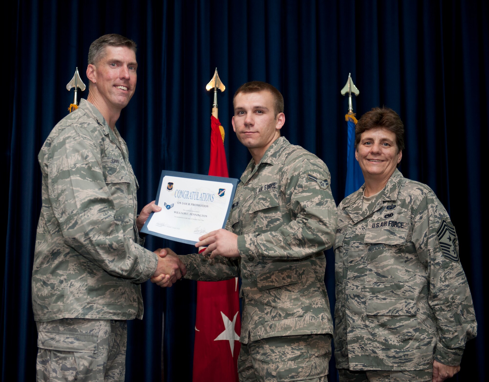 William Pennington, 39th Medical Operations Squadron, is promoted to the rank of airman first class Aug. 31, 2012, at the club complex ballroom at Incirlik Air Base, Turkey. (U.S. Air Force photo by Senior Airman Clayton Lenhardt/Released)