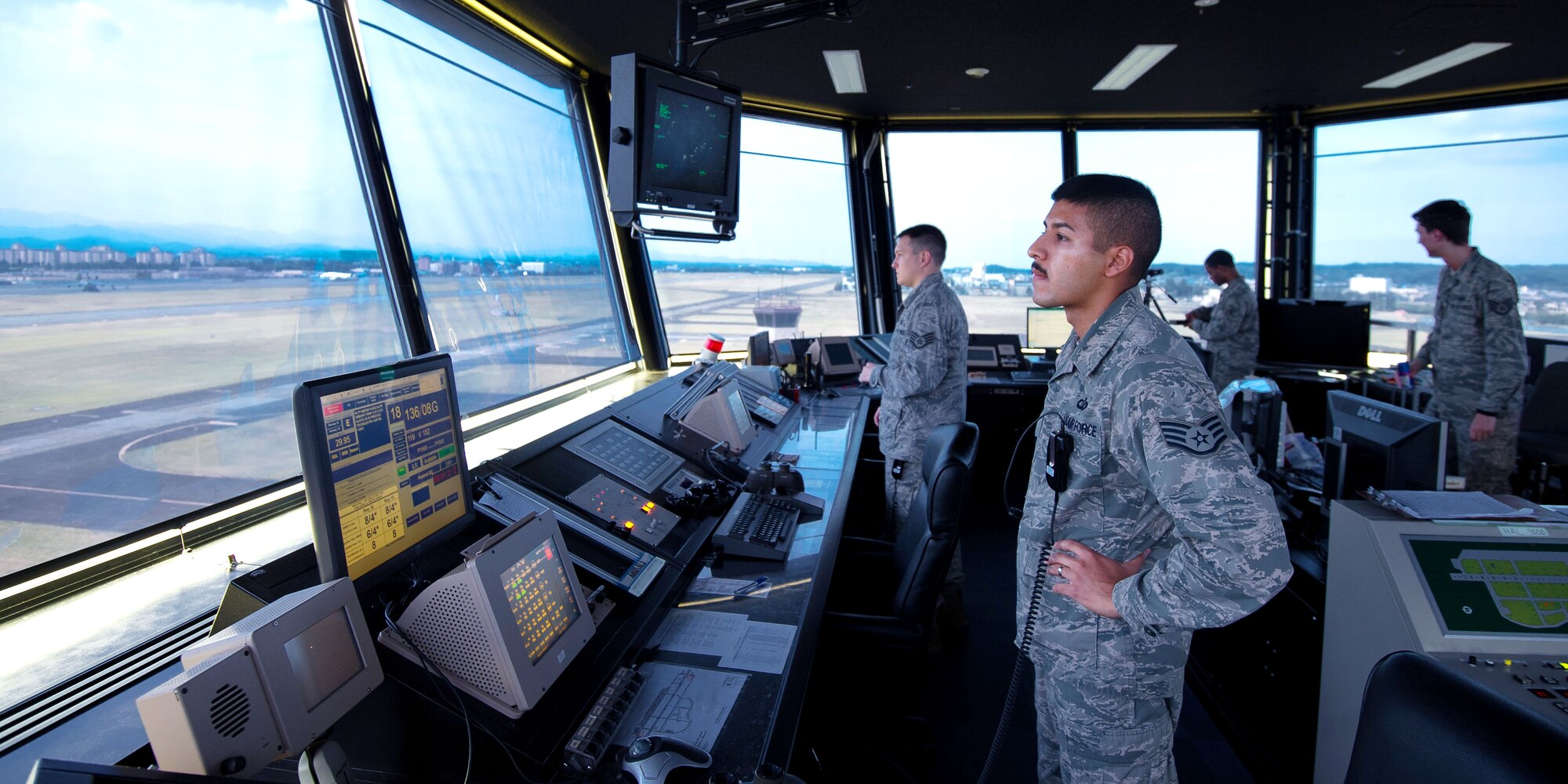 YOKOTA AIR BASE, Japan – Staff Sgt. Bryan Bentley, 374th Operations Support Squadron air traffic controller, watches the Yokota flightline from the air traffic control tower Aug. 29, 2012. In the tower, controllers communicate with several types of aircraft to include the C-130 Hercules, the Cessna 172 and the UH-1 Huey. (U.S. Air Force photo by Staff Sgt. Chad C. Strohmeyer)