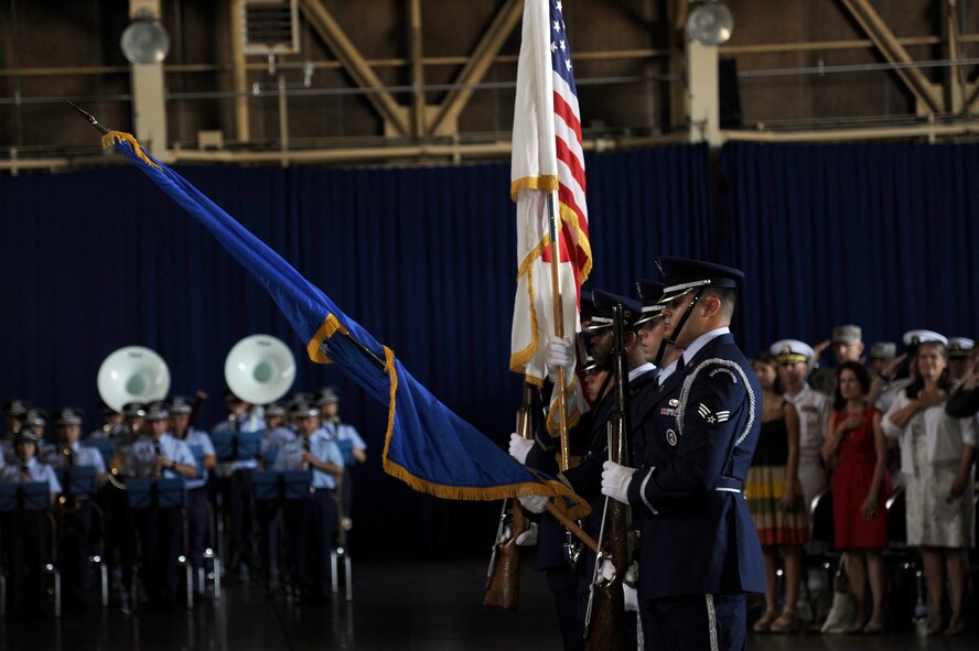 Members of the base honor guard post the colors during the official wing change of command ceremony at Misawa Air Base, Japan, Sept. 4, 2012. U.S. Air Force Brig. Gen. Michael Rothstein relinquished command of the 35th Fighter Wing to Col. Stephen Williams during the official ceremony. (U.S. Air Force photo by Tech. Sgt. Marie Brown)