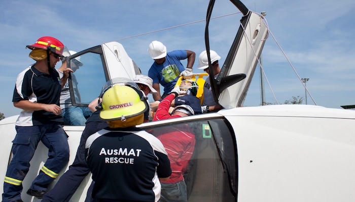 Shock Trauma Platoon, 3rd Medical Battalion, 3rd Marine Logistics Group, III Marine Expeditionary Force, train for a simulated car crash casualty extraction, during a Remote Pre-Hospital Trauma and Disaster Course at the Royal Darwin Hospital, Aug. 23.