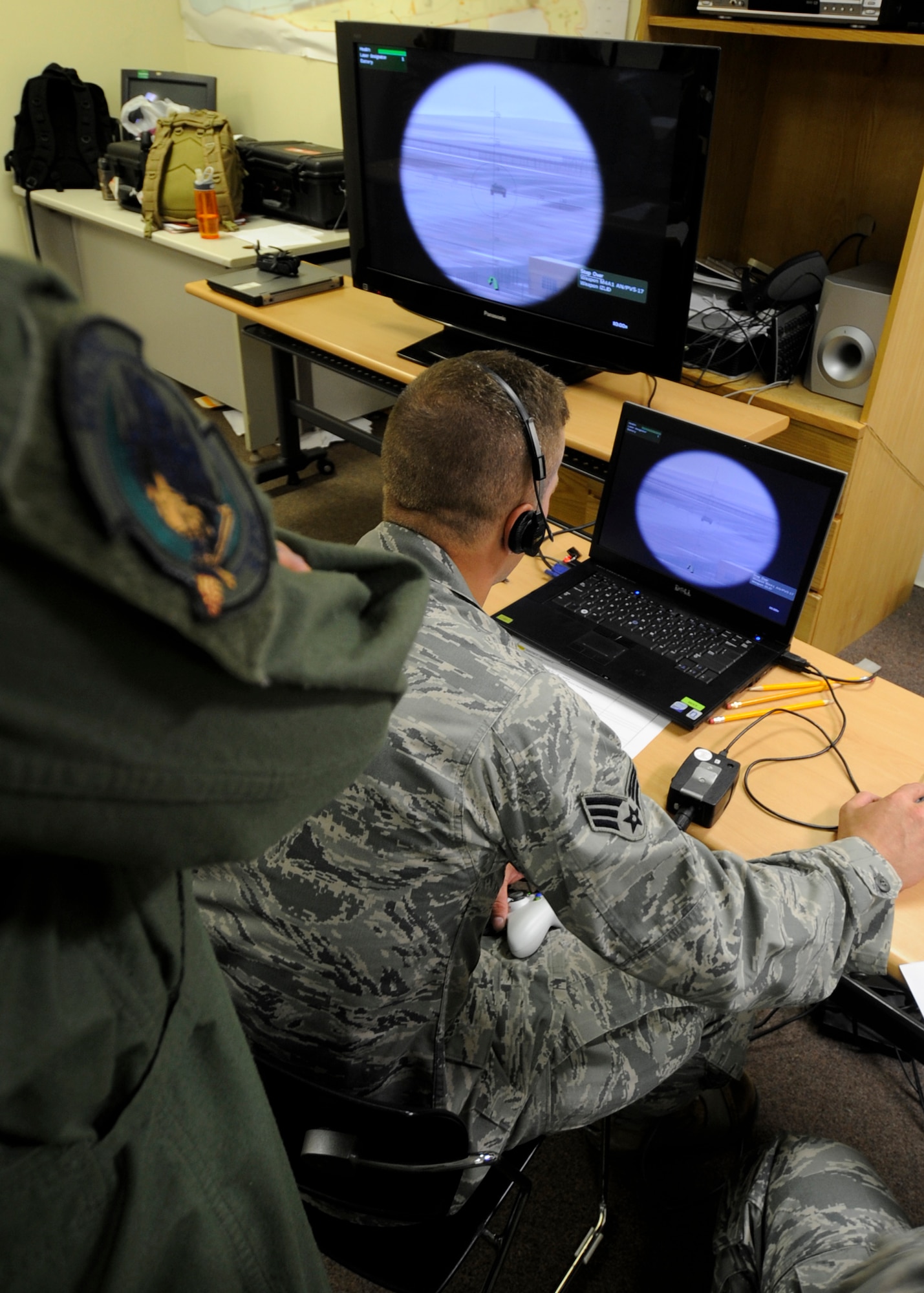 An Airman with the 8th Security Forces Squadron identifies a target on a mobile training program Aug. 29, 2012, on Kunsan Air Base, Republic of Korea. Trainees used the program to identify and call in targets to a gunship as part of “call for fire” training. (U.S. Air Force photo/Senior Airman Jessica Hines)