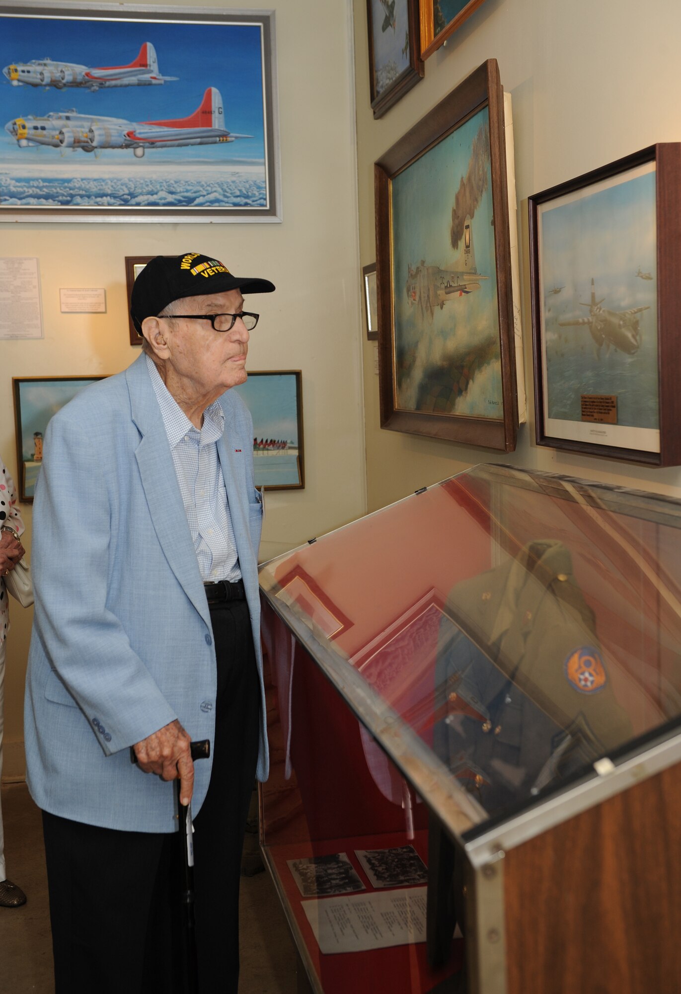 Bataan Death March survivor William Adair views paintings and displays at the 8th Air Force Museum on Barksdale Air Force Base, La., Sept. 4. Adair and four other survivors who visited Barksdale endured a grueling 70-plus mile march through the Philippines during World War II in 1942. After the march, many were kept in internment camps for years as prisoners of war before being released. (U.S. Air Force photo/Airman 1st Class Benjamin Gonsier)(RELEASED)