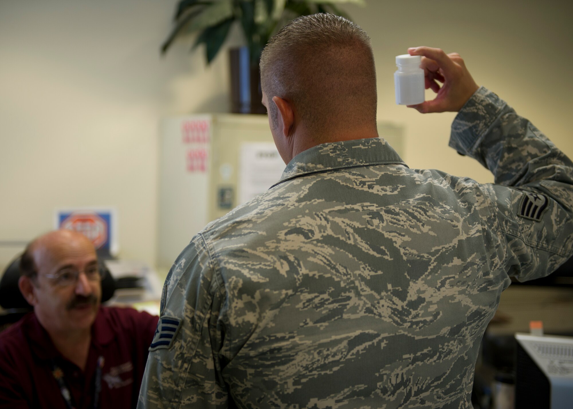 Pasquale Gaccione, 49th Medical Operations Squadron drug reduction program manager, explains proper urinalysis procedures to an Airman randomly selected for urinalysis at Holloman Air Force Base, N.M., Sept. 5. The goal of the drug reduction program is to provide education on why doing drugs is bad not only for Airmen’s careers but also for their bodies. The U.S. Air Force has a zero tolerance toward drug use. (U.S. Air Force photo by Senior Airman DeAndre Curtiss/Released)