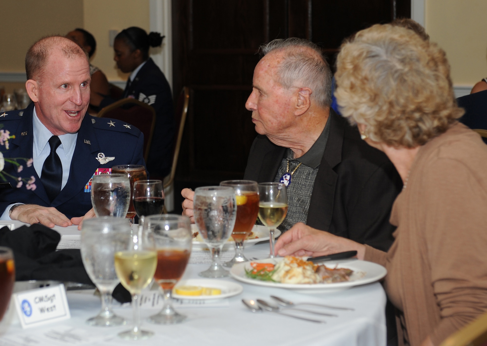 Maj. Gen. Stephen Wilson, 8th Air Force commander, speaks with Bataan Death March survivor Erwin Johnson during a dinner event at Boomtown Casino, Bossier City, La., Sept. 3. Johnson and four other former prisoners of war received medals on behalf of the Philippines for their sacrifice during the Bataan Death March. (U.S. Air Force photo/Airman 1st Class Benjamin Gonsier)(RELEASED)

