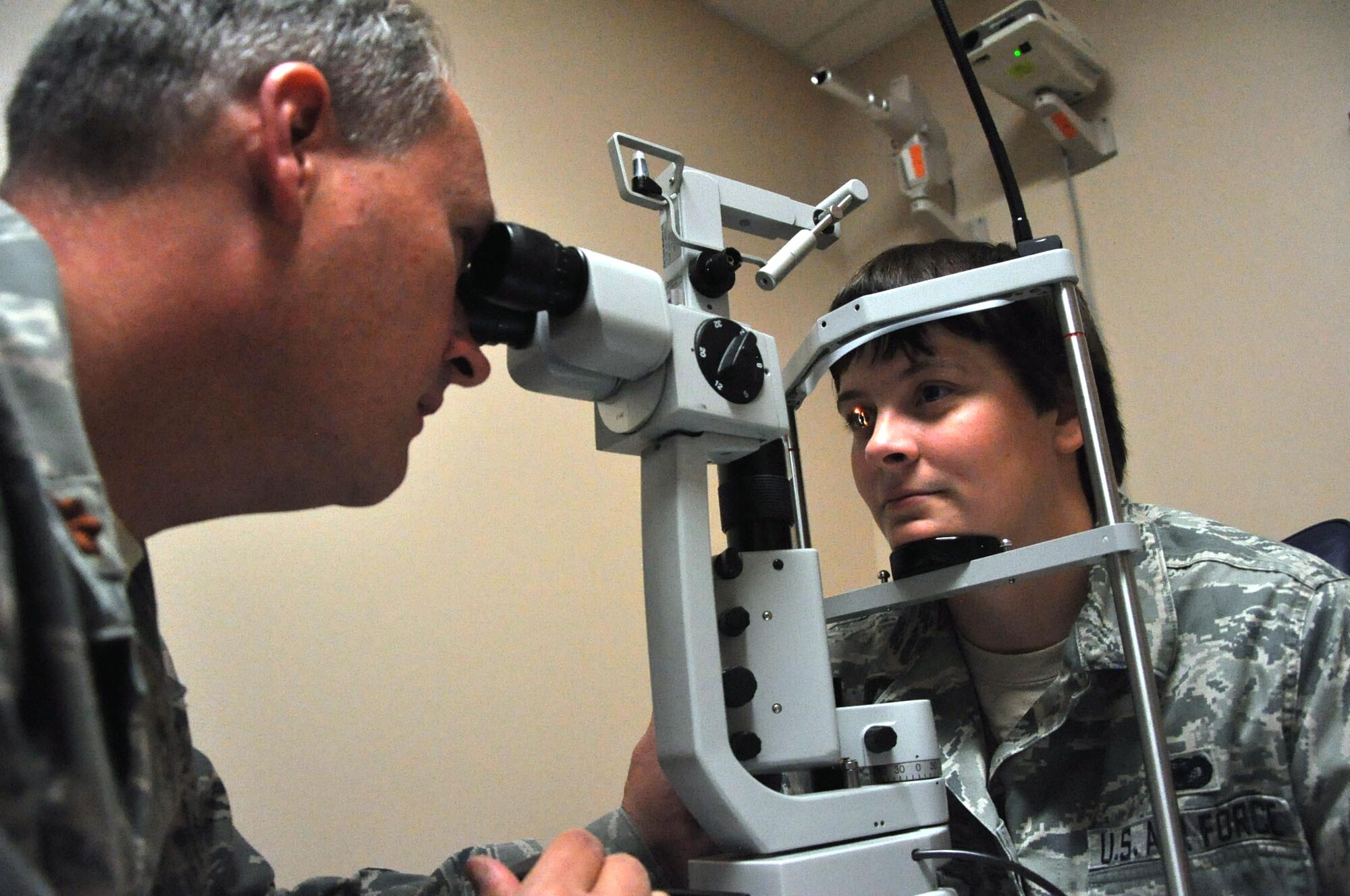 AURORA, Colo. – Maj. Dan Gullekson, 460th Medical Operations Squadron Optometry Element chief, conducts an exam on Senior Airman Megan Littlejohn, 460th Security Forces Squadron, Sept. 5, 2012, at the Buckley Air Force Base Optometry Clinic. Approximately 15 patients are seen each day by the optometry clinic, which serves Team Buckley service members and families. (U.S. Air Force photo by Staff Sgt. Kali L. Gradishar)