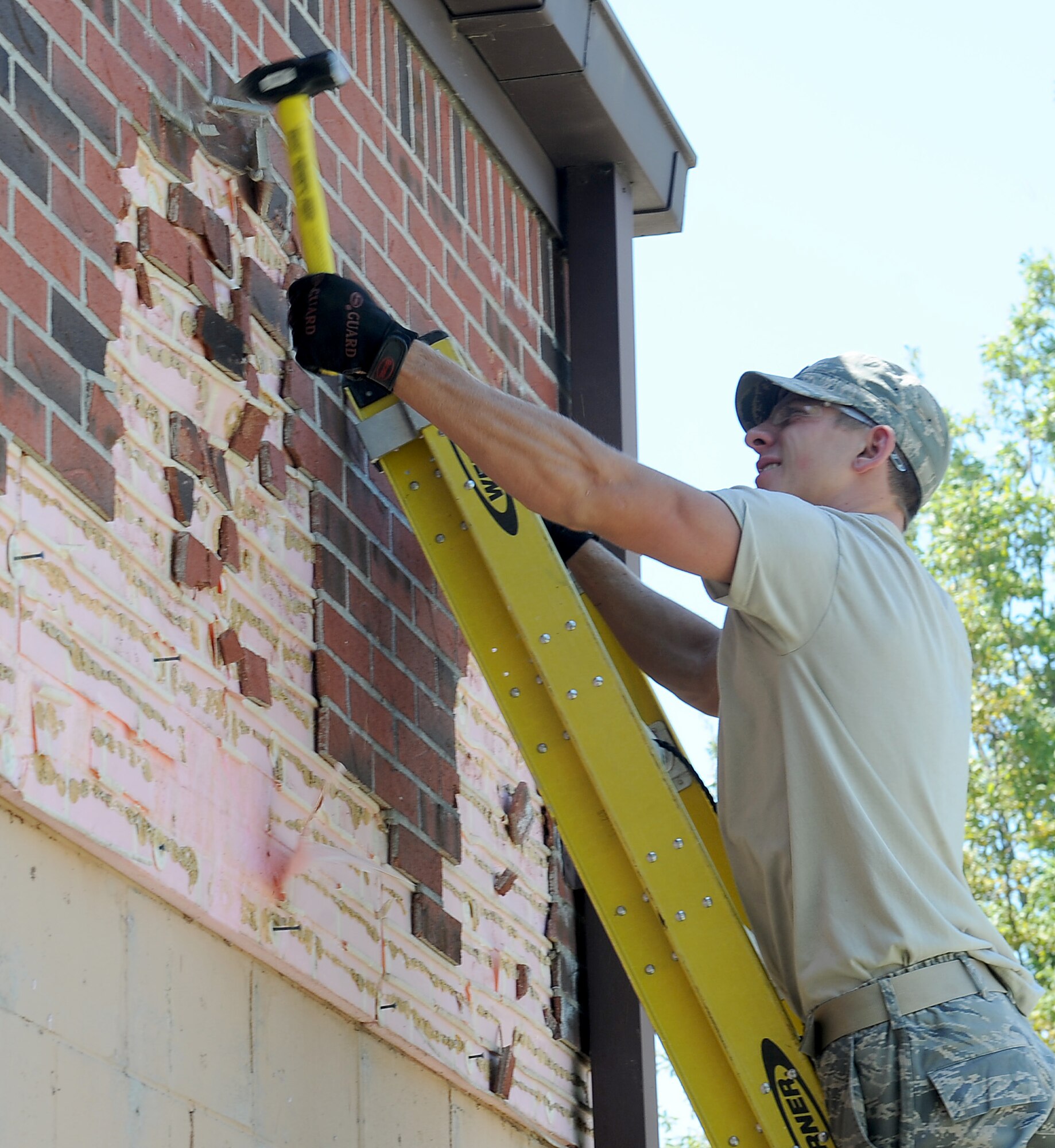 Staff Sgt. Andrew Wright, 375th Civil Engineer Squadron structural journeyman, makes some safety improvements to Rockwell Hall Sept. 22 at Scott Air Force Base.  Wright was replacing a portion of the building’s brick façade, which had reached its life-span and was crumbling. (U.S. Air Force photo/Airman 1st Class Jaeda Waffer)
