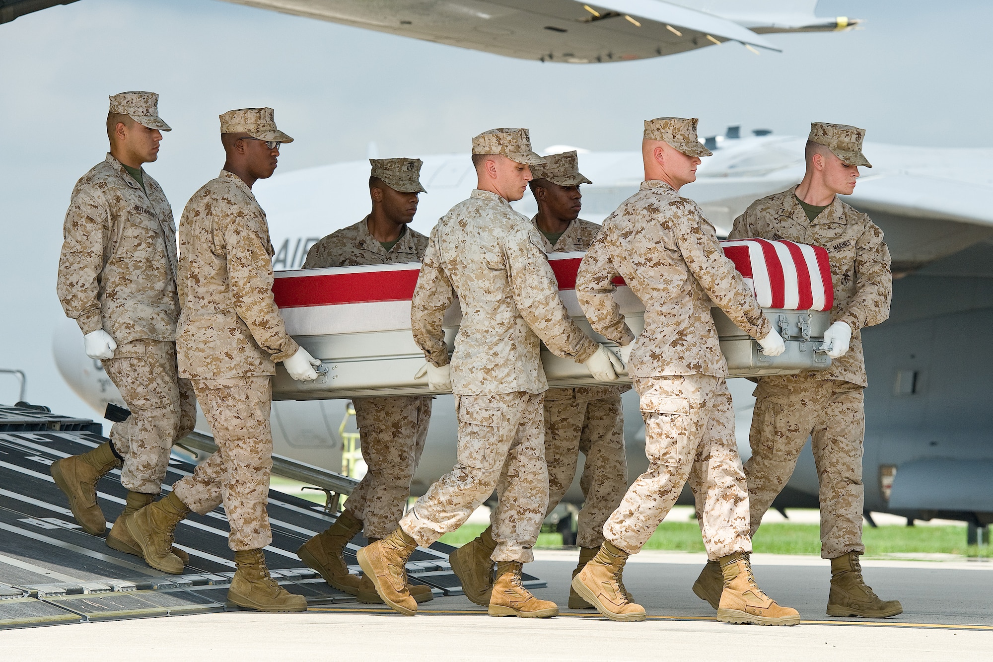 A U.S. Marine Corps carry team transfers the remains of Marine Lance Cpl. Alec R. Terwiske, of Dubois, Ind., at Dover Air Force Base, Del., Sept. 5, 2012. (U.S. Air Force photo/Roland Balik)