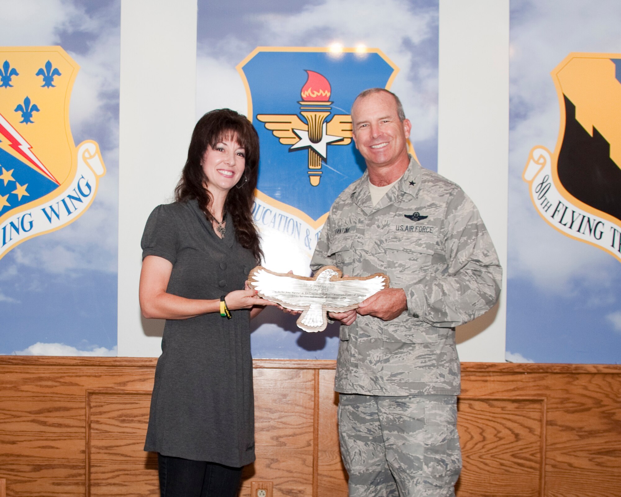 Brig. Gen. Michael Fantini, 82nd Training Wing commander, stands with Ms. Jennifer Schweiger, Executive Director of Straight Street Ministry to Youth on Sep. 5, 2012, at the Sheppard Air Force Base club.  Schweiger, spoke during the kick-off breakfast for the 2012 Combined Federal Campaign about the importance of helping people.  (U.S. Air Force Photo by Danny Webb) 