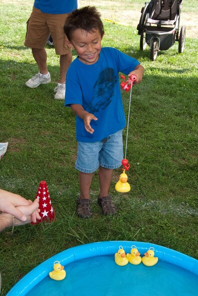HANSCOM AIR FORCE BASE, Mass. – Lawrence Pan plays a game at the BBQ and Blues held Aug. 30. The town festival-like event kicked off just after Heroes Homecoming. (U.S. Air Force photo by Mark Herlihy)