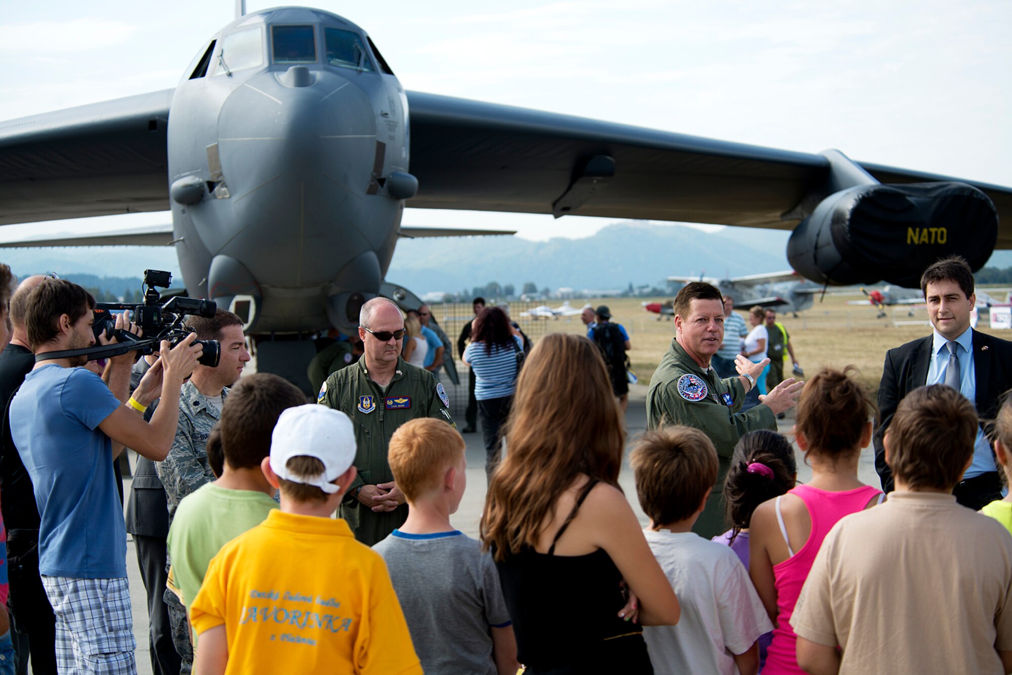 U.S. Air Force Lt. Col. Dave Webb, 307th Operations Support Flight commander, and Col. Keith Schultz, 307th Operations Group commander, answer questions from a group of Slovakian school students during a tour of a B-52H Stratofortress on Aug. 31, 2012, Sliac, Slovakia. The students were given a special tour of the aircraft prior to the next day's start of the Slovak International Air Fest air show. (U.S. Air Force photo by Master Sgt. Greg Steele/Released)