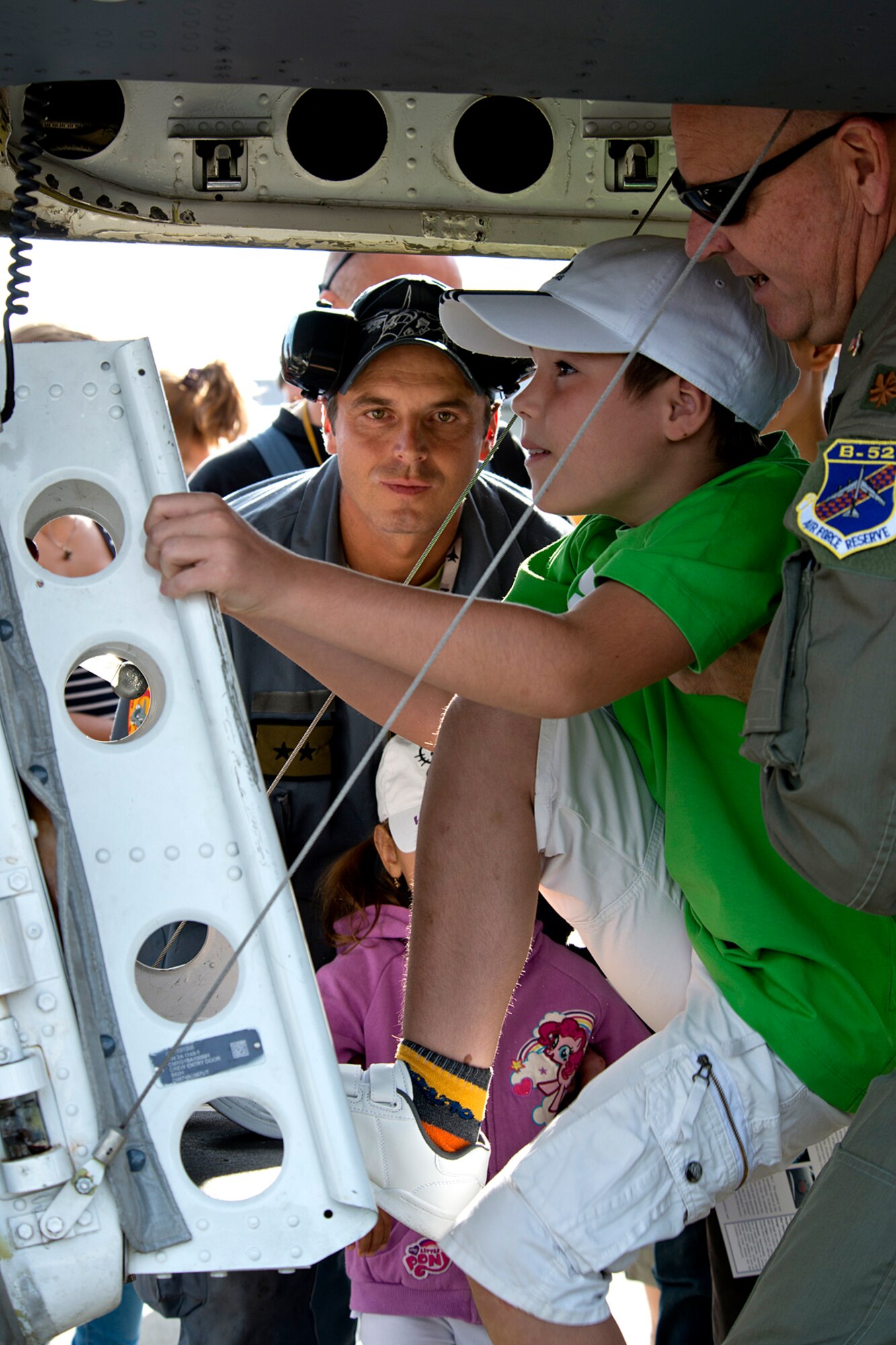 A school student is helped up the hatch of a B-52H Stratofortress by U.S. Air Force Maj. Charles McCoy, 93rd Bomb Squadron Intelligence Officer, during a special tour given to students on Aug. 31, 2012, Sliac, Slovakia. The B-52 is assigned to the 307th Bomb Wing, Barksdale Air Force Base, La., and arrived in Sliac to support the Slovak International Air Fest air show. (U.S. Air Force photo by Master Sgt. Greg Steele/Released)