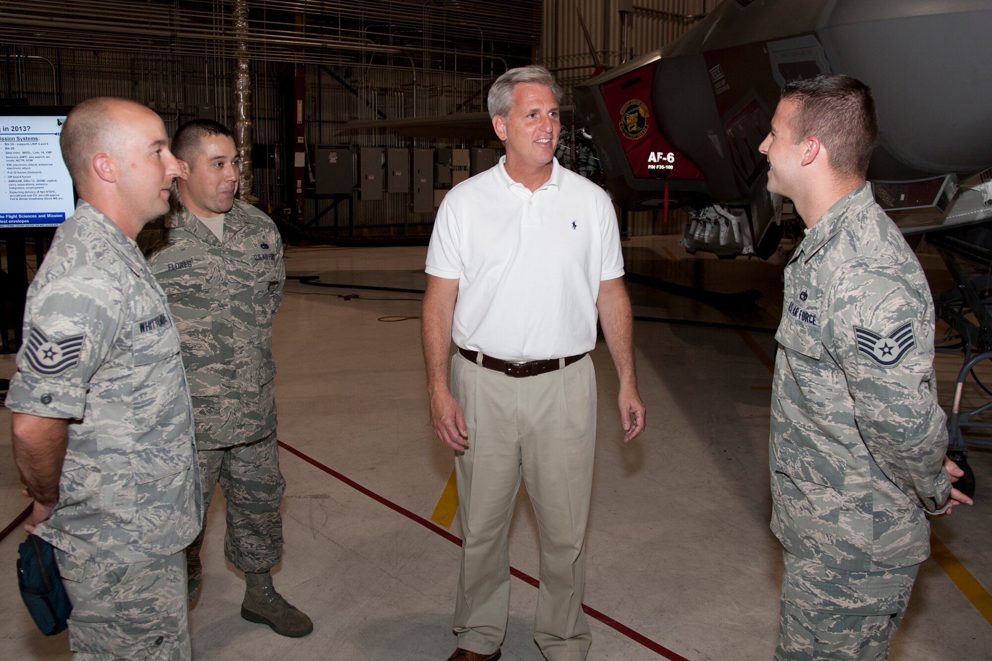 Congressman McCarthy speaks with Aimen from the 461st Flight Test Squadron, JSF Integrated Test Force.  (Courtesy photo by Paul Weatherman/Lockheed Martin)
