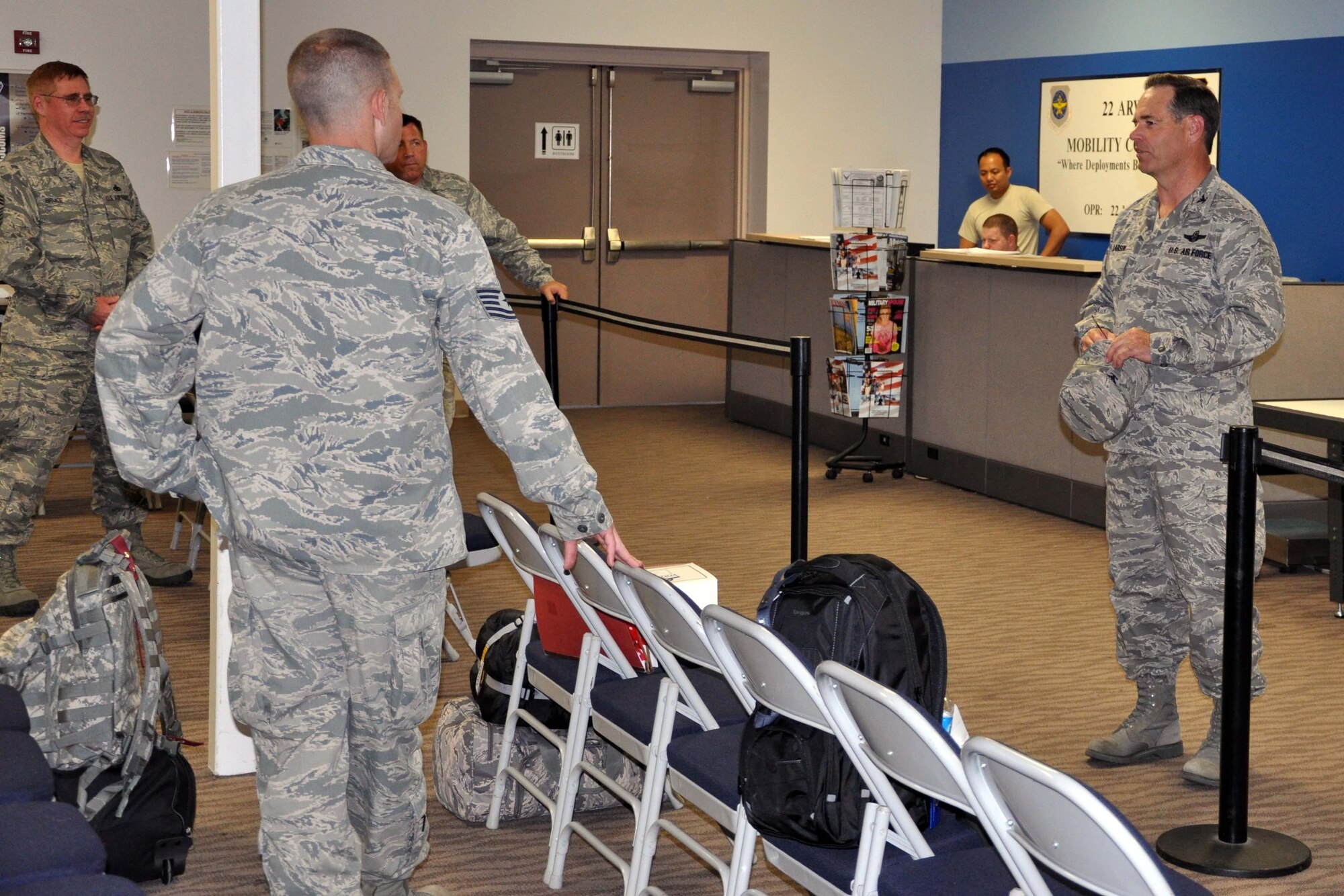 Col. Mark S. Larson, commander of the 931st Air Refueling Group, addresses deploying members of the 931st as they wait to board aircraft at the passenger terminal at McConnell Air Force Base, Kan.  Members of the 931st have deployed to Southwest Asia in support of ongoing U.S. operations overseas. (U.S. Air Force photo by 1st Lt. Zach Anderson)