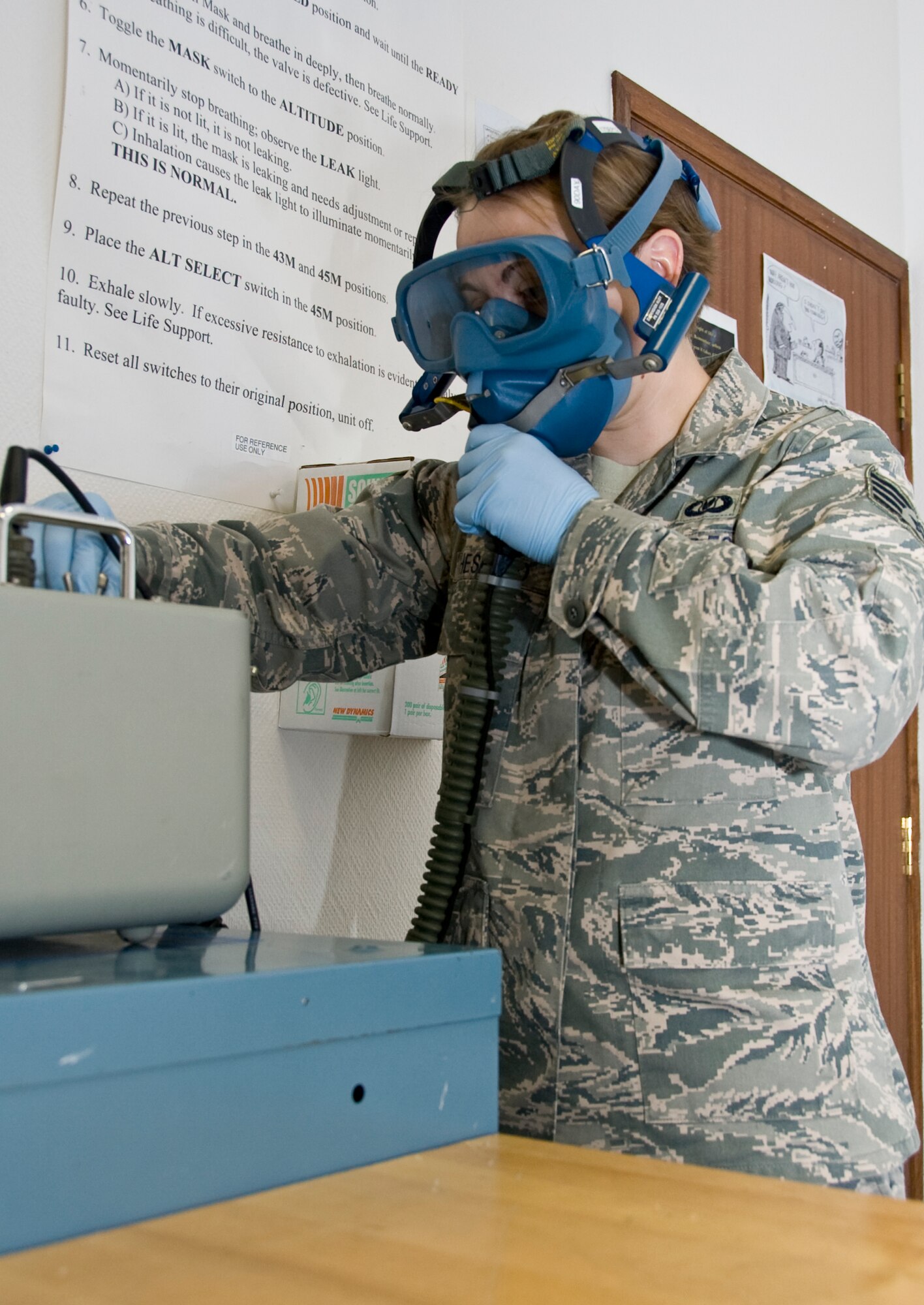 Staff Sgt. Christy Chesebro, 379th Aircrew Flight Equipment KC-135 Stratotanker technician, conducts a routine inspection on a Scot 358 quick don mask to ensure there are no leaks in the hose or mask Sept. 5, 2012. Chesebro, and other KC-135 technicians, conduct routine inspections on all equipment the crew requires during their mission. She is deployed from Kadena Air Base, Japan, and is a native of Topeka, Kan. (U.S. Air Force photo by Senior Airman Bryan Swink)