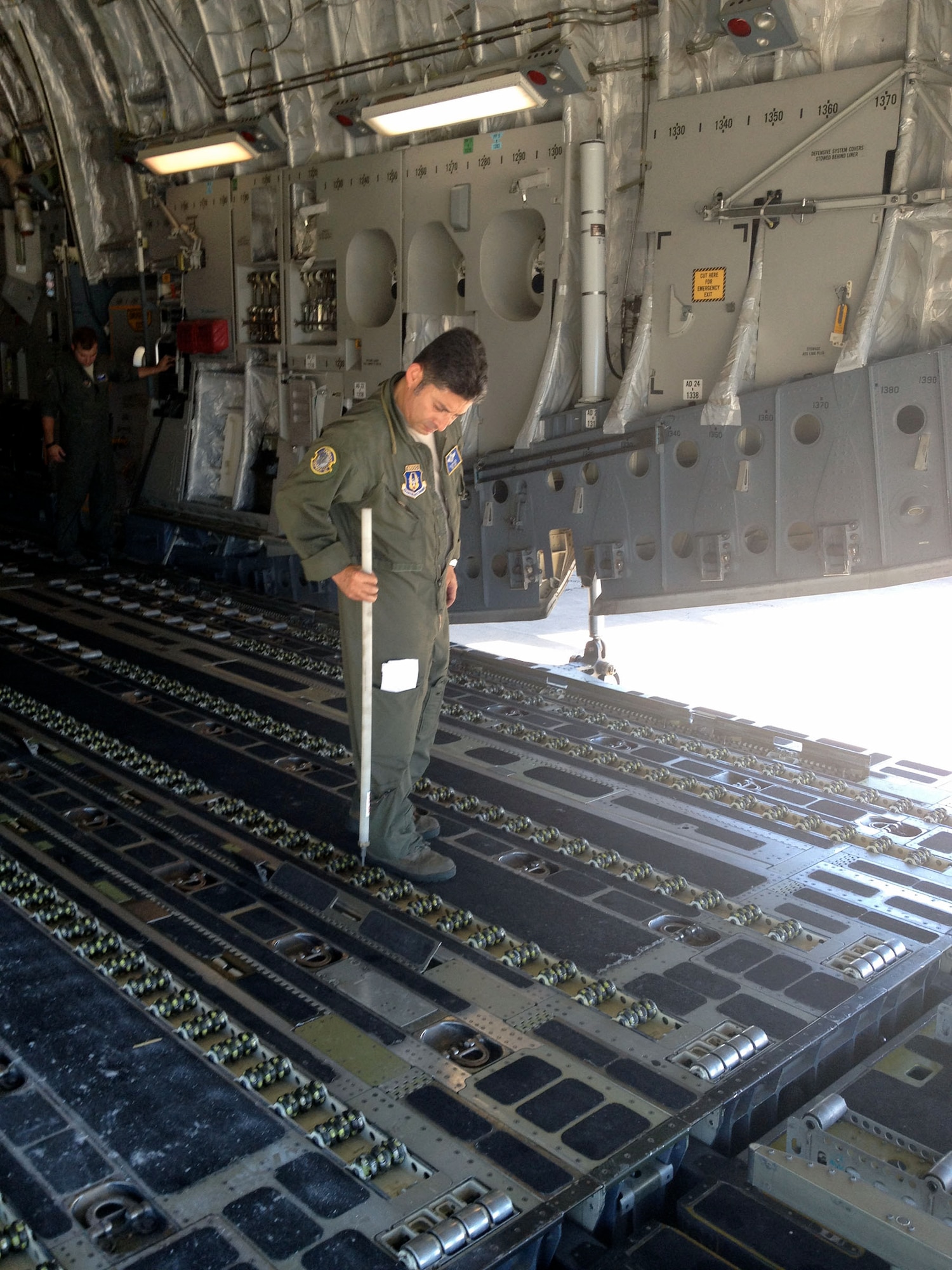 WRIGHT-PATTERSON AIR FORCE BASE, Ohio – Tech. Sgt. William Lugo, 89th Airlift Squadron loadmaster, prepares the cargo area of a 445th Airlift Wing C-17 Globemaster III for loading five pallets of cargo containing rice and other supplies needed in Haiti Aug. 31. The C-17 moved more than 105,000 pounds of cargo to and from Joint Base Charleston, S.C., to Haiti as part of the Denton Program, a program that allows donors to use space available on U.S. military cargo planes to transport humanitarian goods and equipment to countries in need. (Courtesy photo)